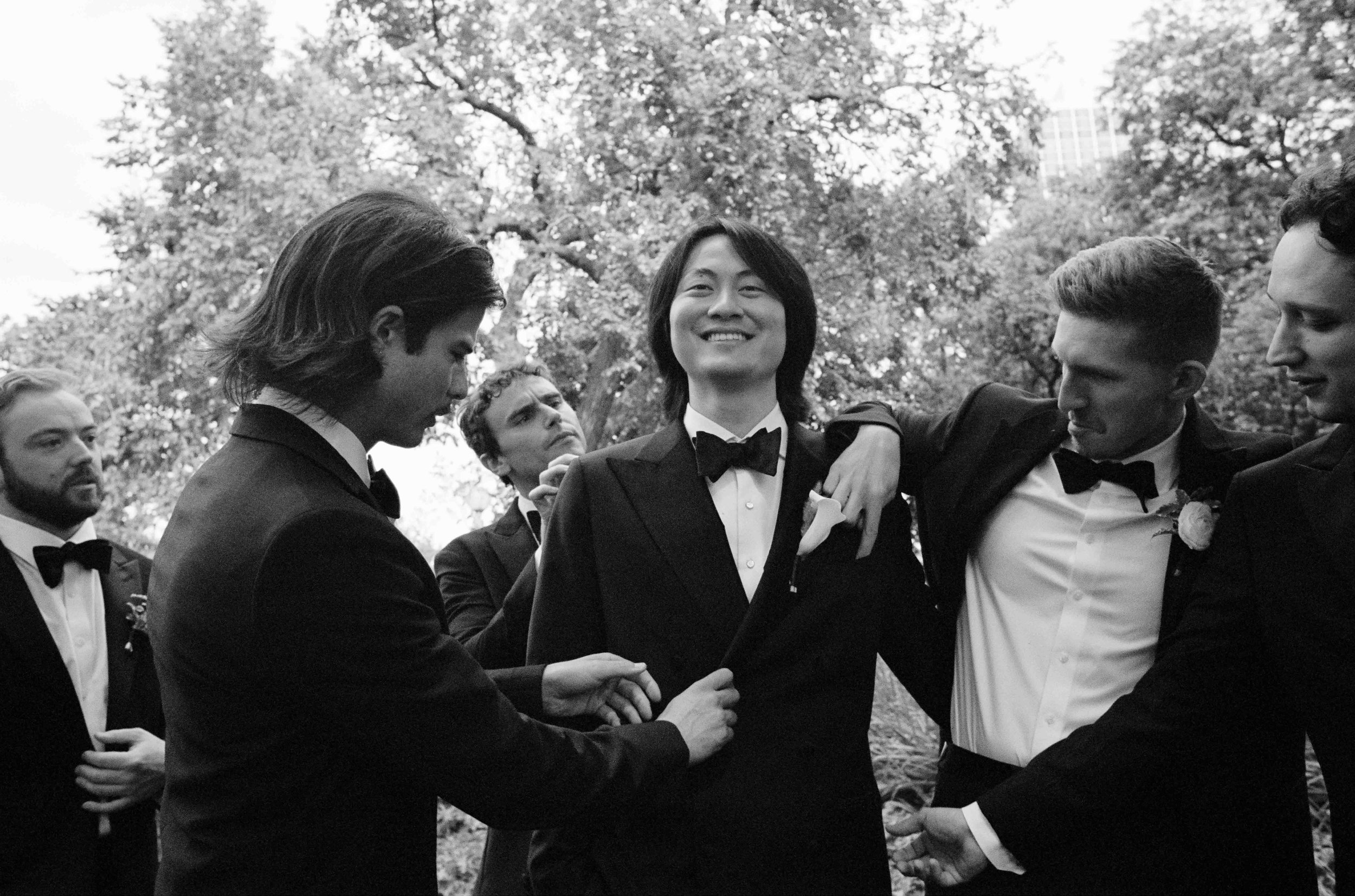 Bride and groom get married at the Chicago History Museum, with creative, lively wedding focused on community, family, laughter. Documentary and candid photos on analog nostalgic film. Weddings by Grace is a Chicago lesbian queer luxury wedding photo