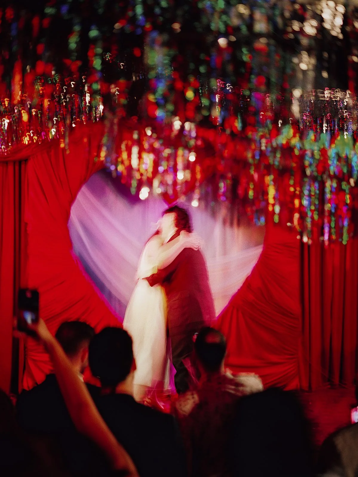 Queer couple gets married in Chicago at the empty bottle with creative, lively wedding focused on community, family, laughter. Documentary and candid photos on analog nostalgic film. Weddings by Grace is a Chicago lesbian queer luxury wedding photogr