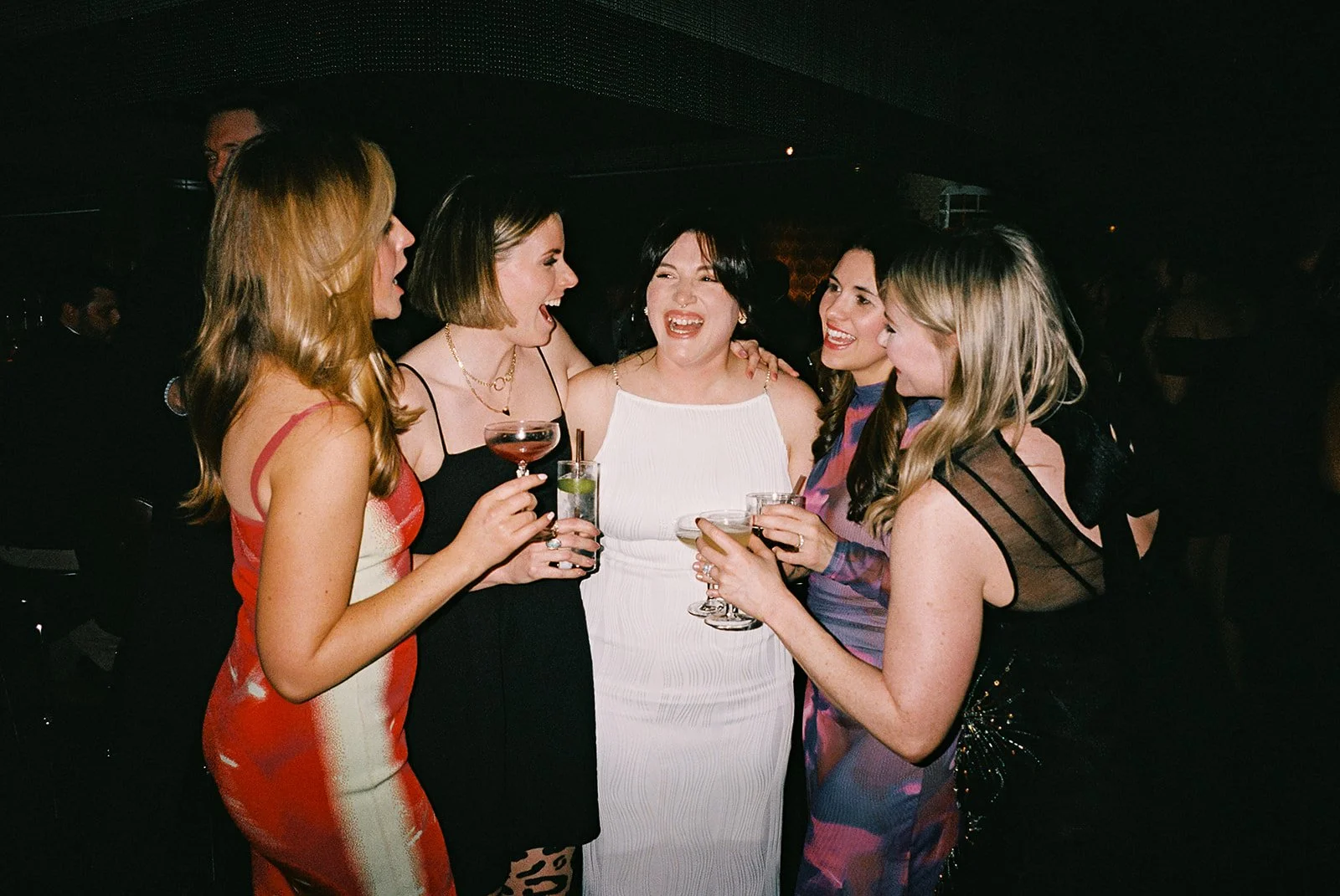Fun flash photos of lesbian wedding at Dorothy bar. Documentary and candid photos on flash film. Weddings by Grace is a Chicago lesbian queer luxury wedding photographer specializing in portraits, candid, editorial, documentary, + artistic images wit