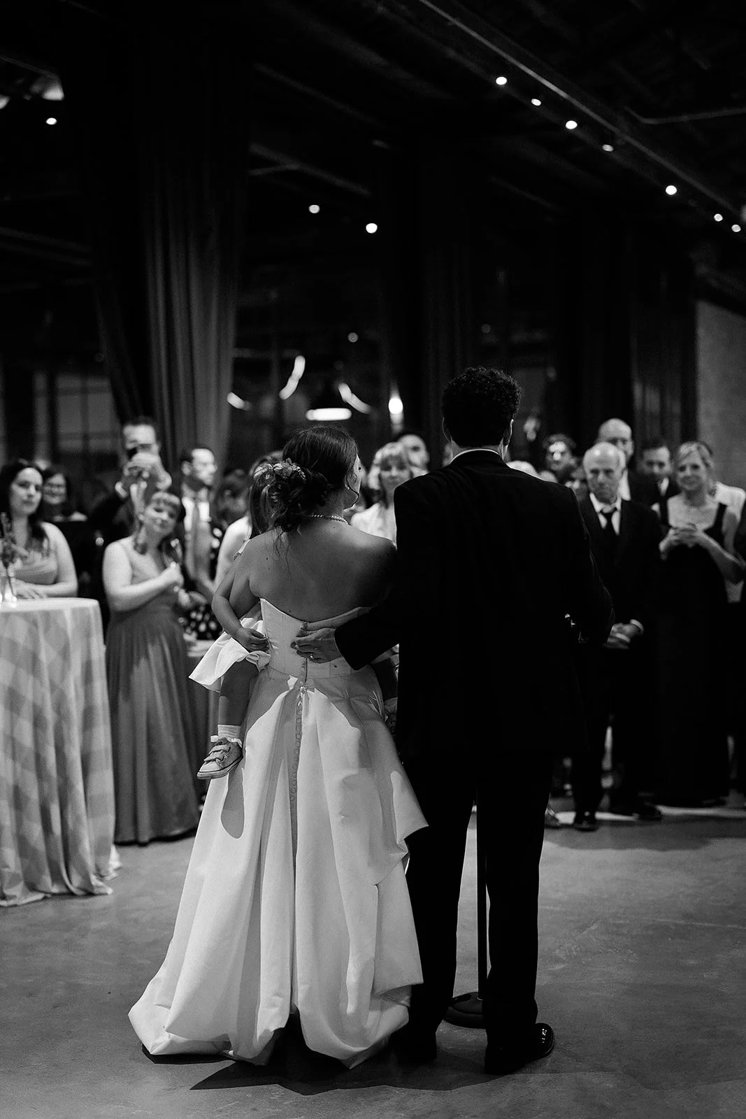 Bride and groom get married in Chicago at WildmanBT, with creative, lively wedding focused on community, family, laughter. Documentary and candid photos on flash film. Weddings by Grace is a Chicago lesbian queer luxury wedding photographer specializ