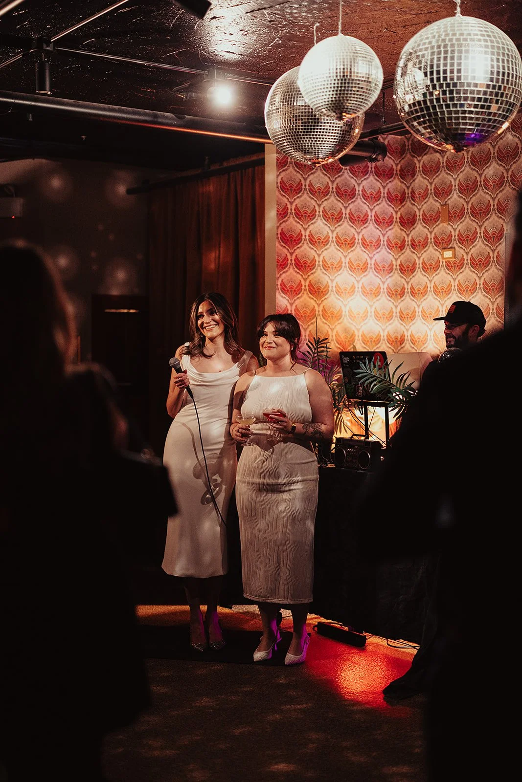 Fun flash photos of lesbian wedding at Dorothy bar. Documentary and candid photos on flash film. Weddings by Grace is a Chicago lesbian queer luxury wedding photographer specializing in portraits, candid, editorial, documentary, + artistic images wit