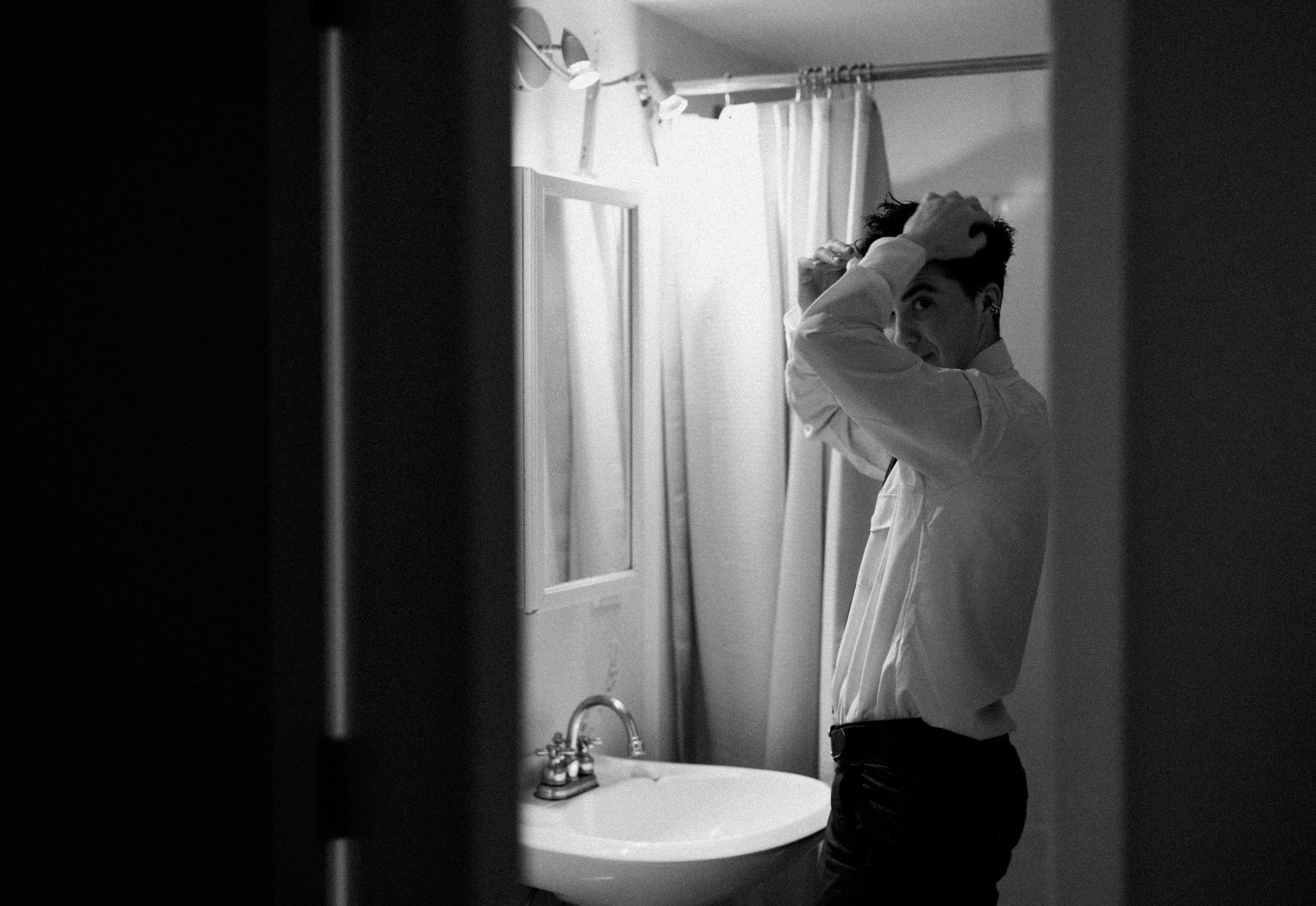 candid flash photo of reception on film. Bride and Groom marry at Lincoln Park Conservatory and Salvatores. Grace Coudal is a Chicago lesbian photographer specializing in portraits, candid, editorial, documentary, events, + weddings. Analog film wedd