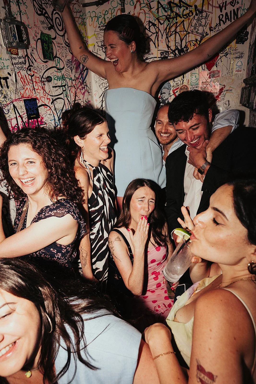 Queer couple gets married in Chicago at the empty bottle with creative, lively wedding focused on community, family, laughter. Documentary and candid photos on analog nostalgic film. Weddings by Grace is a Chicago lesbian queer luxury wedding photogr