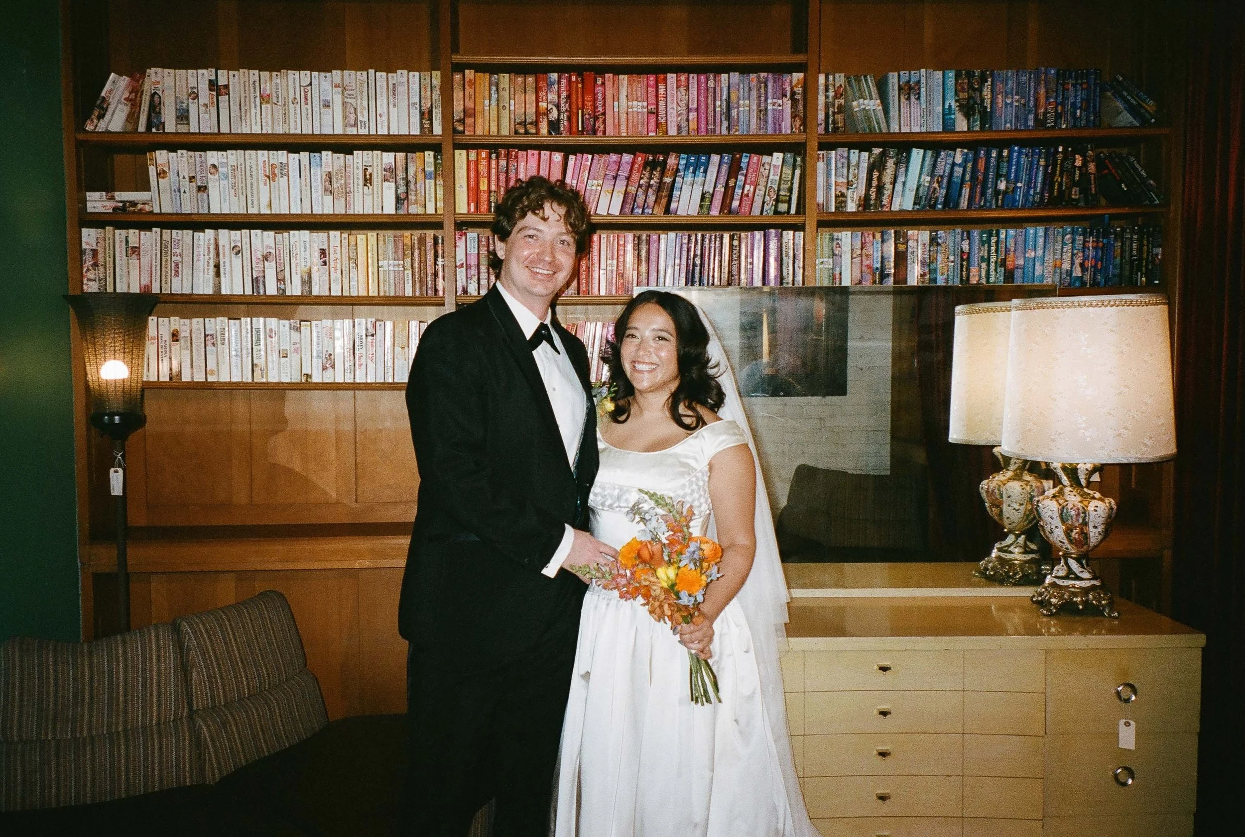 Bride and groom get married in Chicago at Salvage One, with creative, lively wedding focused on community, family, laughter. Documentary and candid photos on analog nostalgic film. Weddings by Grace is a Chicago lesbian queer luxury wedding photograp