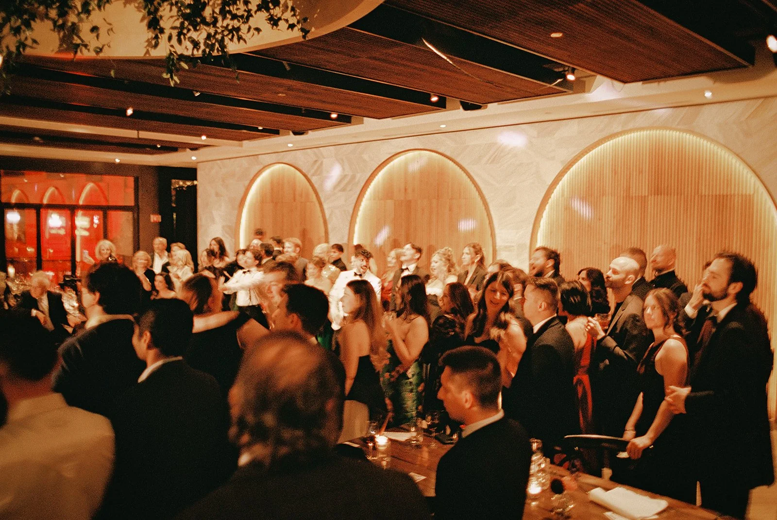 Two grooms get married downtown on Halloween night at chicago winery. Queer, gay, black tie, high-end party and drag show. Documentary and candid photos on flash film. Weddings by Grace is a Chicago lesbian queer luxury wedding photographer specializ