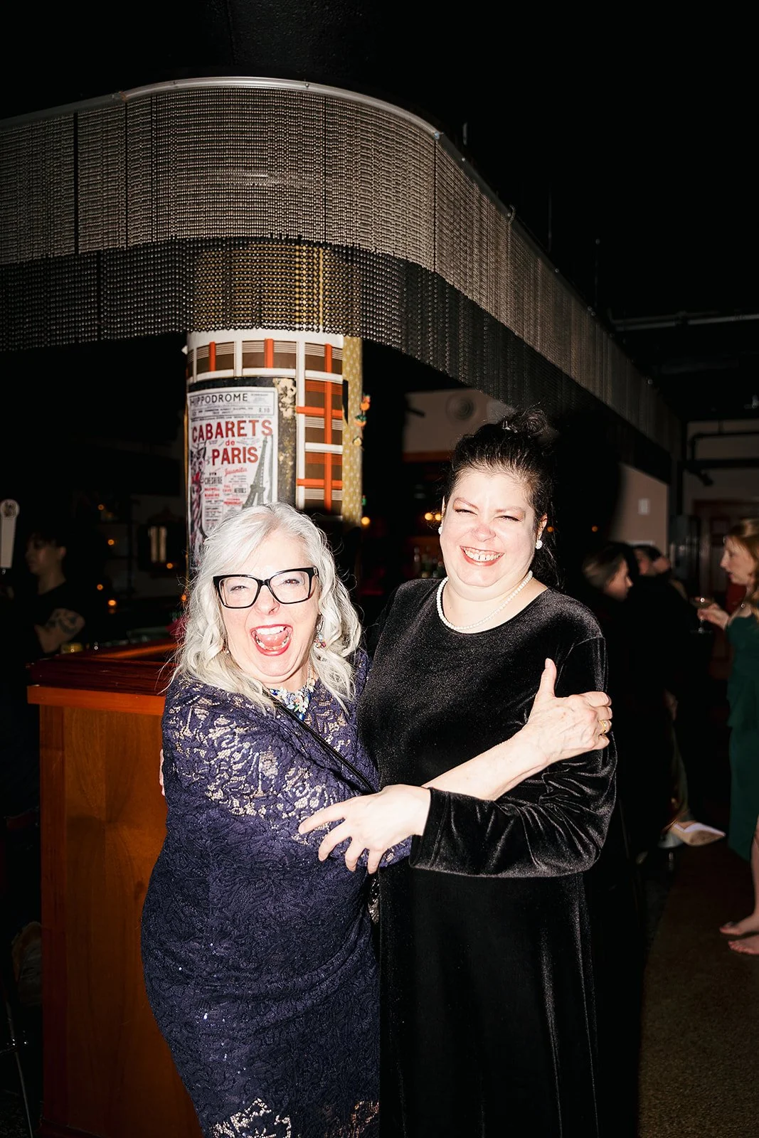 Fun flash photos of lesbian wedding at Dorothy bar. Documentary and candid photos on flash film. Weddings by Grace is a Chicago lesbian queer luxury wedding photographer specializing in portraits, candid, editorial, documentary, + artistic images wit