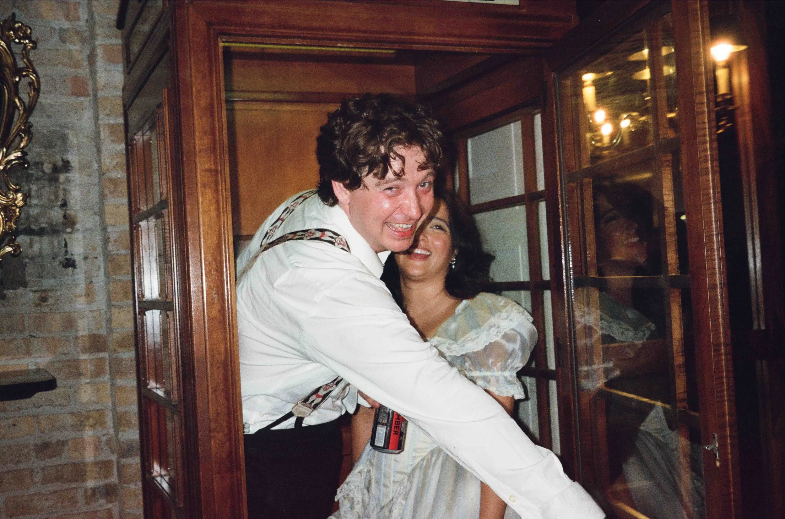 Bride and groom get married in Chicago at Salvage One, with creative, lively wedding focused on community, family, laughter. Documentary and candid photos on analog nostalgic film. Weddings by Grace is a Chicago lesbian queer luxury wedding photograp