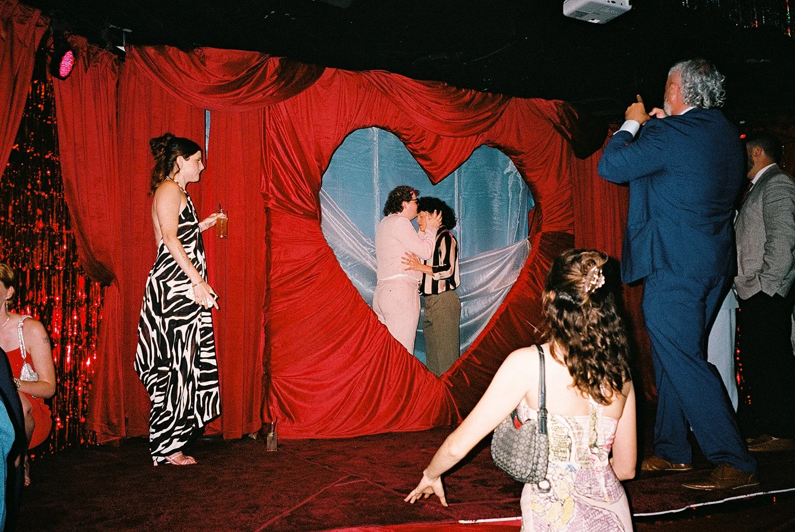 Queer couple gets married in Chicago at the empty bottle with creative, lively wedding focused on community, family, laughter. Documentary and candid photos on analog nostalgic film. Weddings by Grace is a Chicago lesbian queer luxury wedding photogr