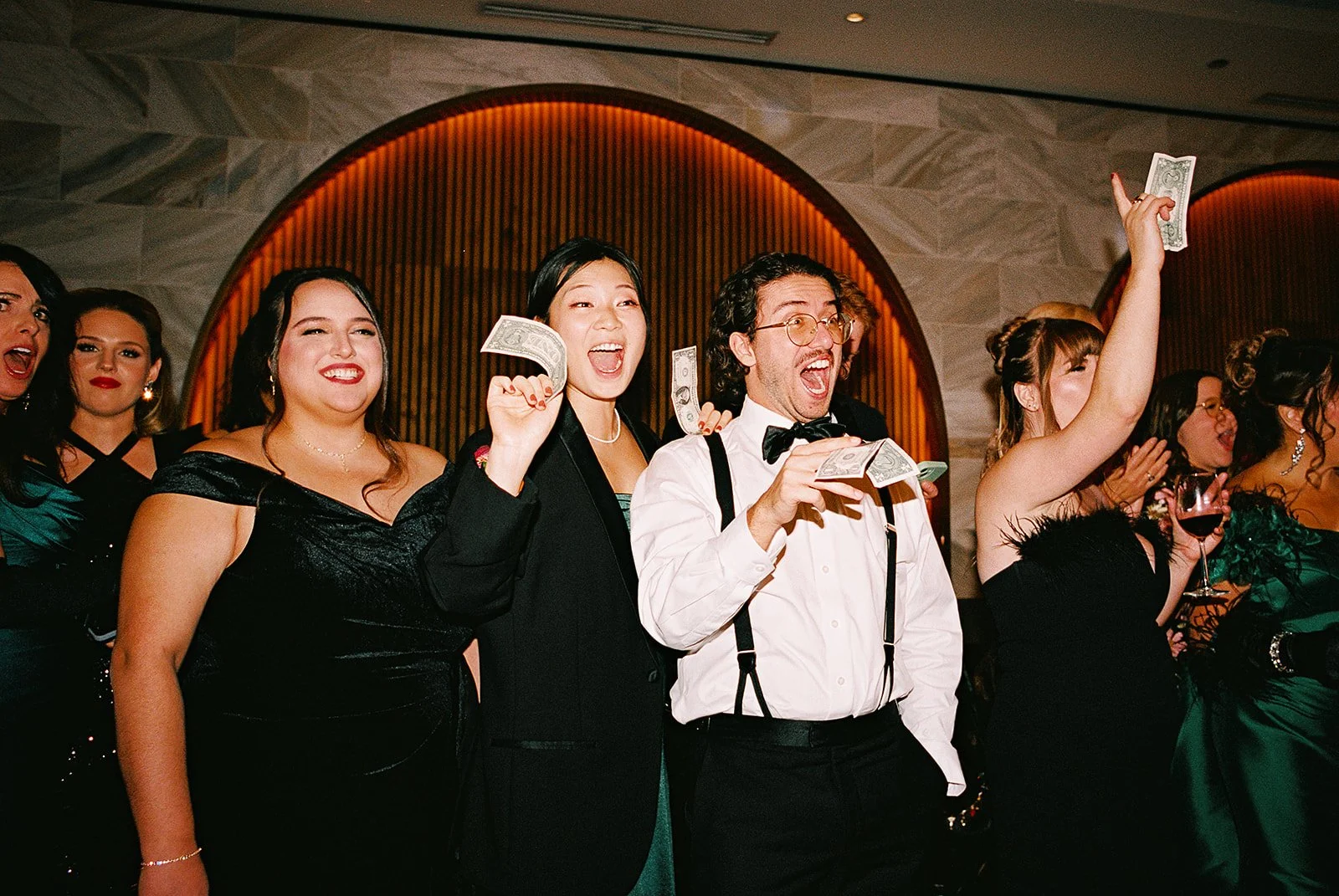 Two grooms get married downtown on Halloween night at chicago winery. Queer, gay, black tie, high-end party and drag show. Documentary and candid photos on flash film. Weddings by Grace is a Chicago lesbian queer luxury wedding photographer specializ