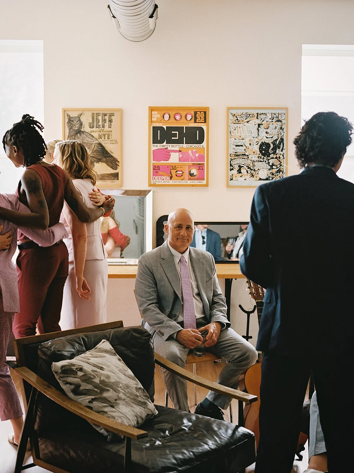 Queer couple gets married in Chicago at the empty bottle with creative, lively wedding focused on community, family, laughter. Documentary and candid photos on analog nostalgic film. Weddings by Grace is a Chicago lesbian queer luxury wedding photogr