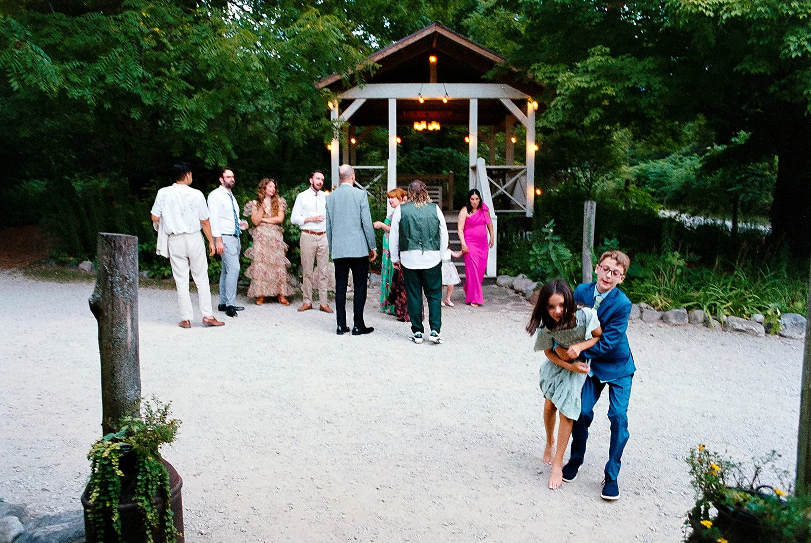 Bride and groom get married at the Millcreek Wilde in St. Joseph, Michigan. Grace Coudal is a Chicago lesbian photographer specializing in portraits, candid, editorial, documentary, events, + weddings. Analog film wedding photography, queer-owned.