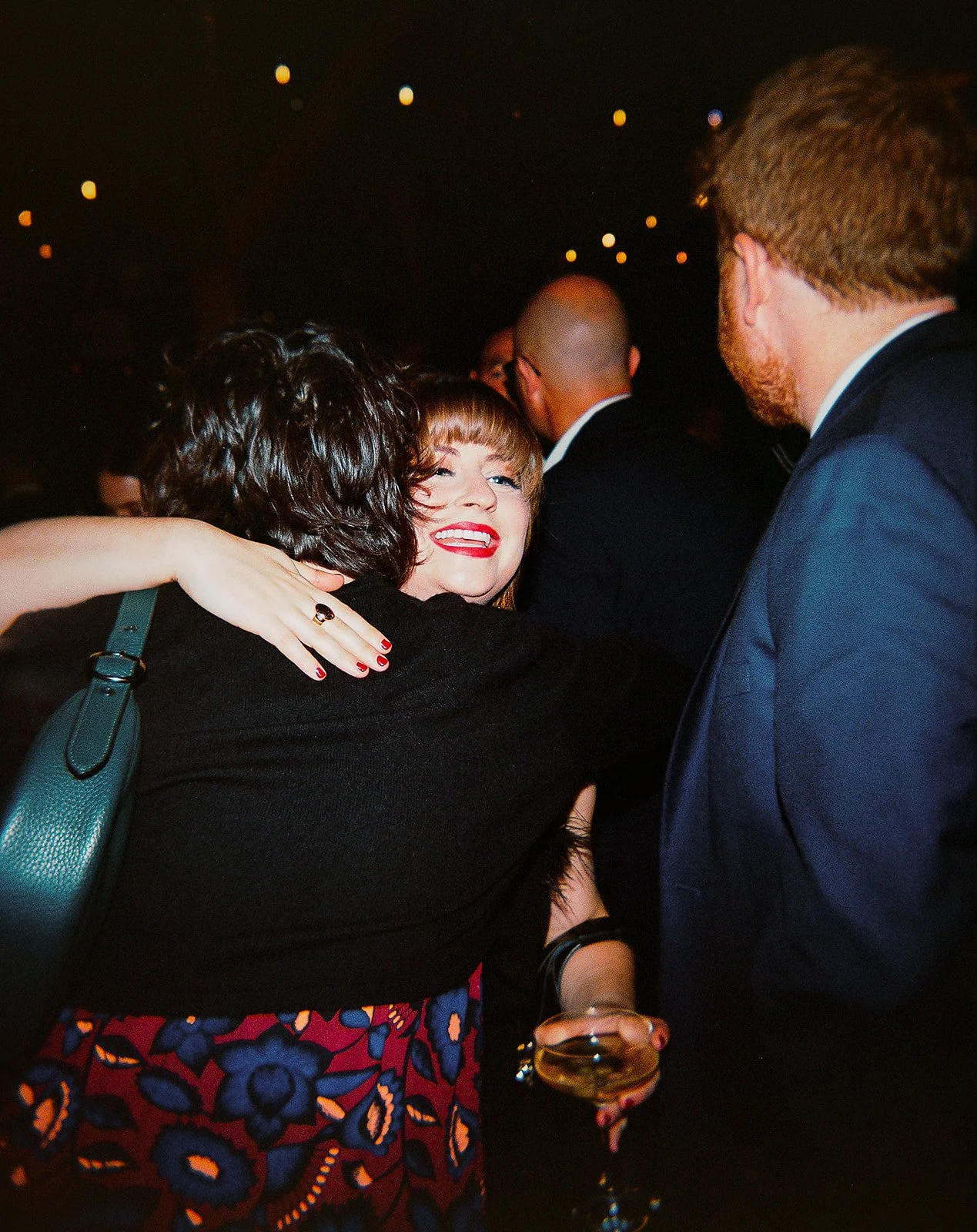 Two grooms get married downtown on Halloween night at chicago winery. Queer, gay, black tie, high-end party and drag show. Documentary and candid photos on flash film. Weddings by Grace is a Chicago lesbian queer luxury wedding photographer specializ