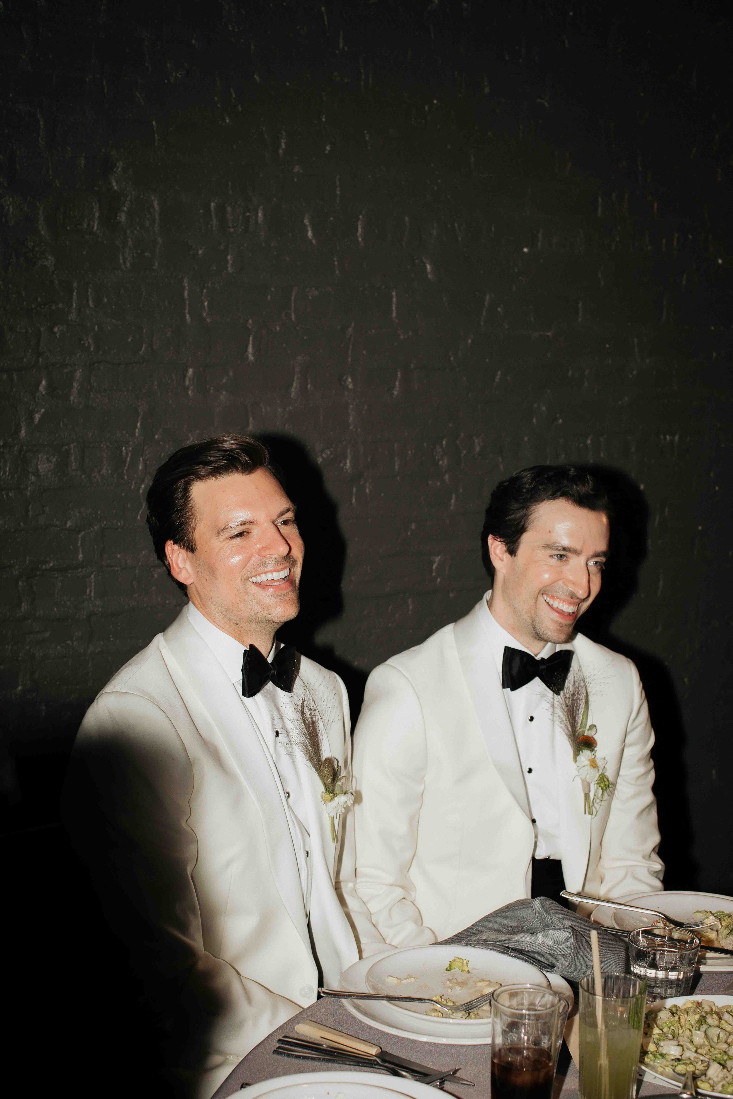 Groom and groom get married at maxwells trading with creative, lively wedding focused on community, queer family, laughter. Documentary and candid photos on analog nostalgic film. Weddings by Grace is a Chicago lesbian queer luxury wedding photograph