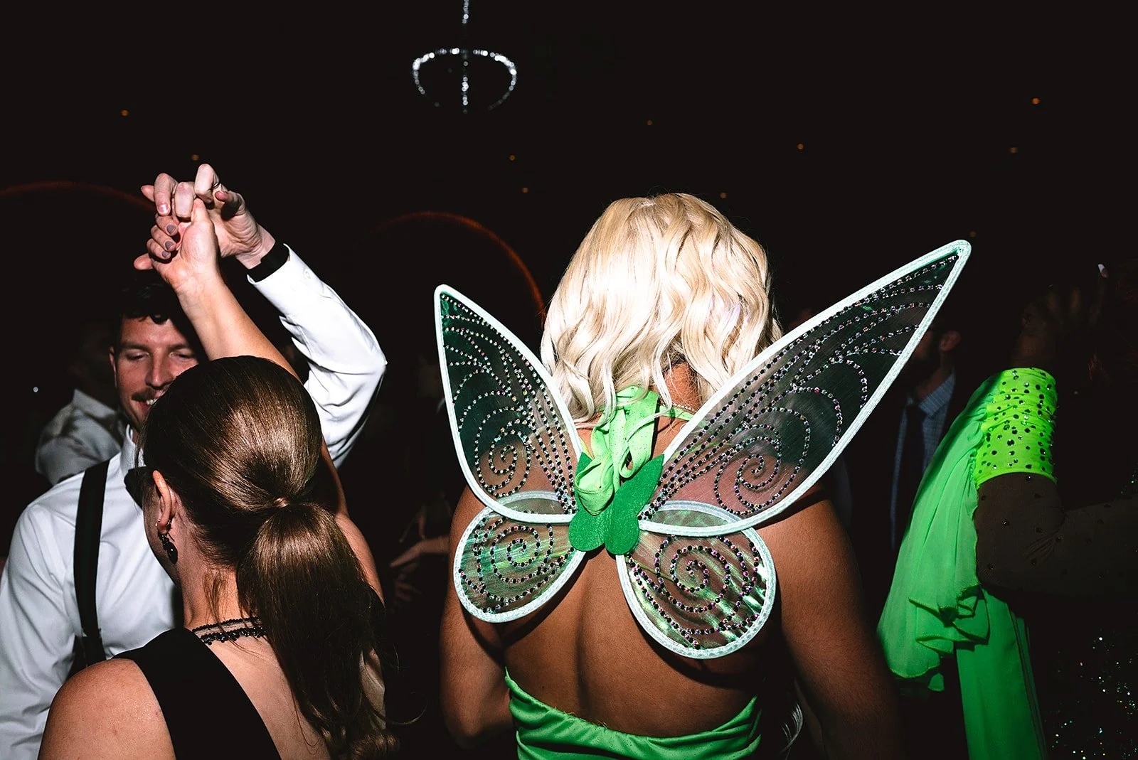 Two grooms get married downtown on Halloween night at chicago winery. Queer, gay, black tie, high-end party and drag show. Documentary and candid photos on flash film. Weddings by Grace is a Chicago lesbian queer luxury wedding photographer specializ