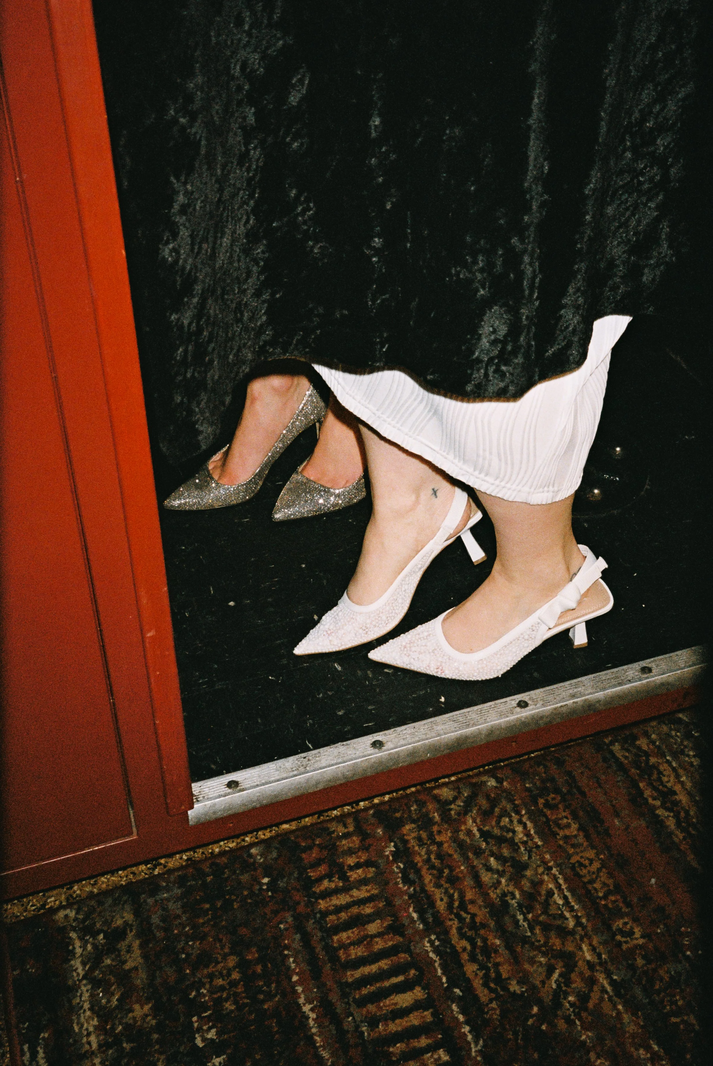 Fun flash photos of lesbian wedding at Dorothy bar. Documentary and candid photos on flash film. Weddings by Grace is a Chicago lesbian queer luxury wedding photographer specializing in portraits, candid, editorial, documentary, + artistic images wit