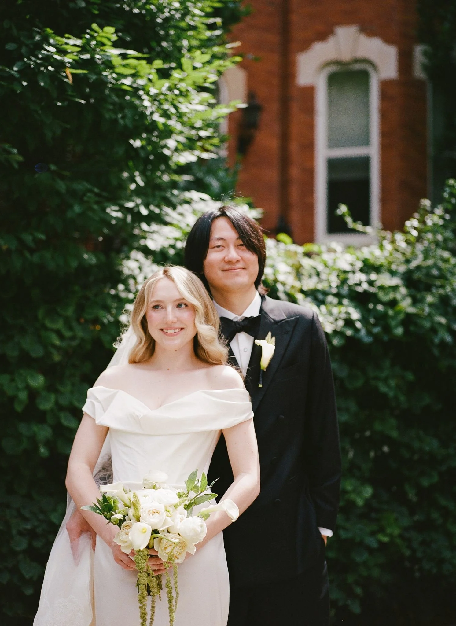 Bride and groom get married at the Chicago History Museum, with creative, lively wedding focused on community, family, laughter. Documentary and candid photos on analog nostalgic film. Weddings by Grace is a Chicago lesbian queer luxury wedding photo
