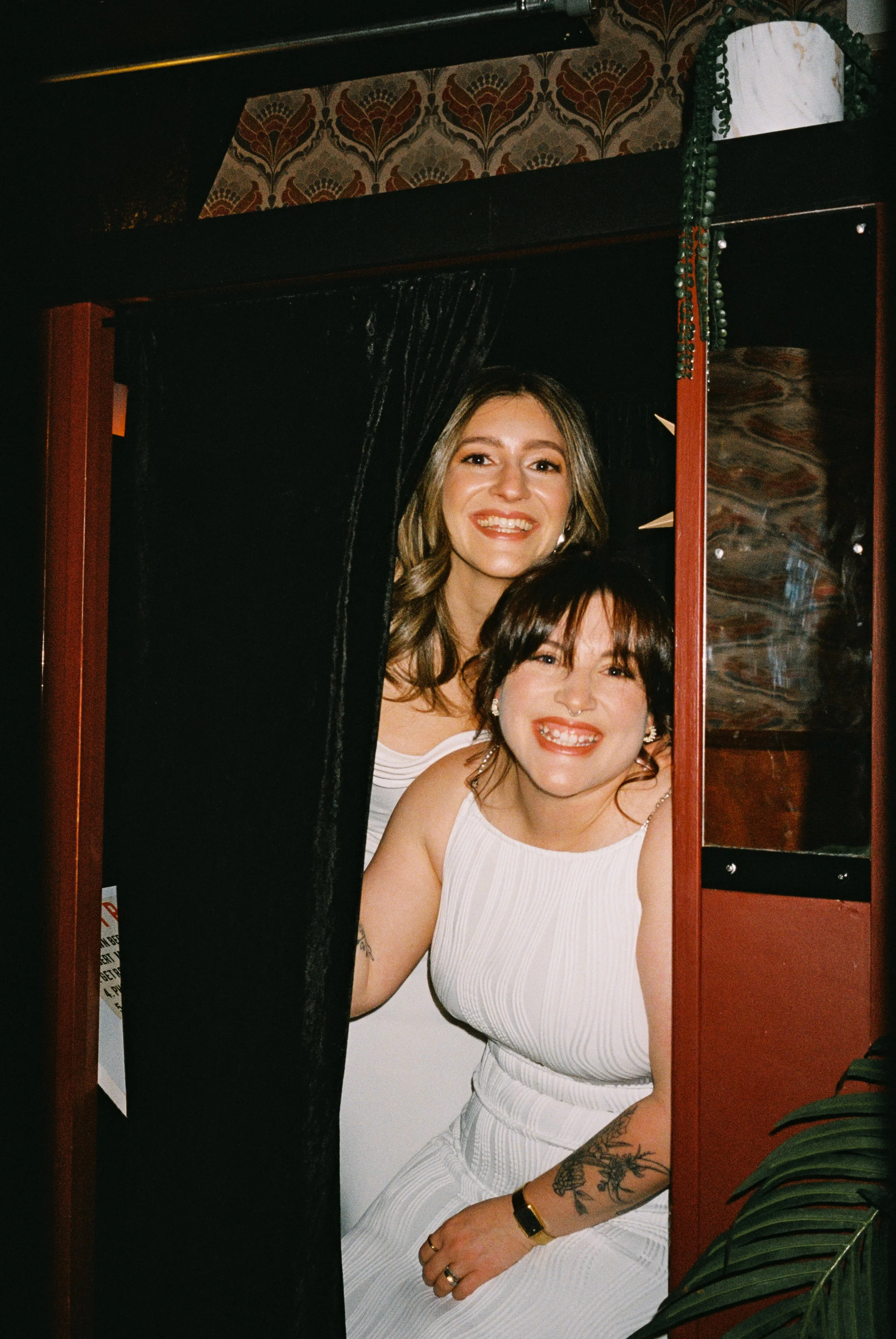Fun flash photos of lesbian wedding at Dorothy bar. Documentary and candid photos on flash film. Weddings by Grace is a Chicago lesbian queer luxury wedding photographer specializing in portraits, candid, editorial, documentary, + artistic images wit