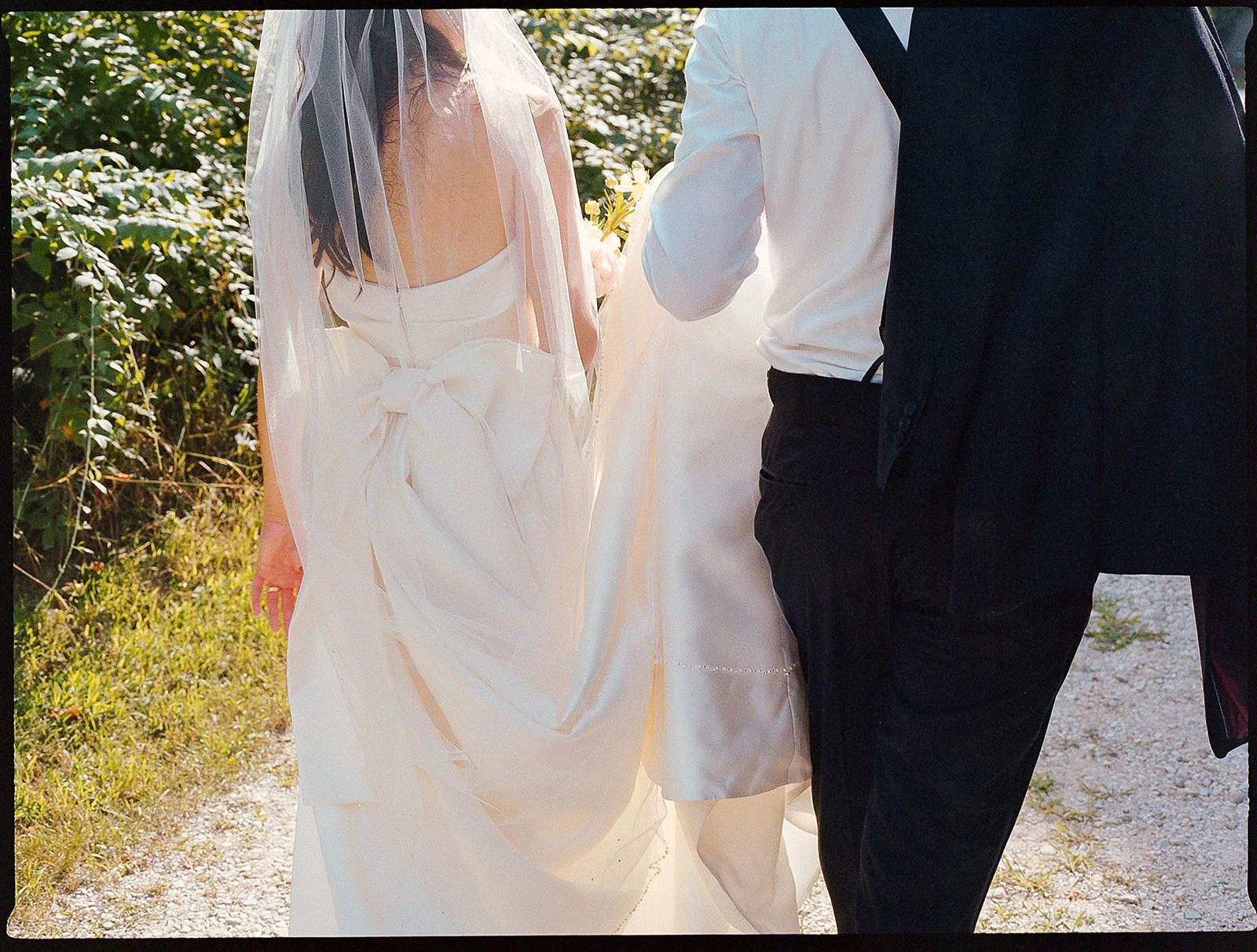 Bride and groom get married at the Millcreek Wilde in St. Joseph, Michigan. Grace Coudal is a Chicago lesbian photographer specializing in portraits, candid, editorial, documentary, events, + weddings. Analog film wedding photography, queer-owned.