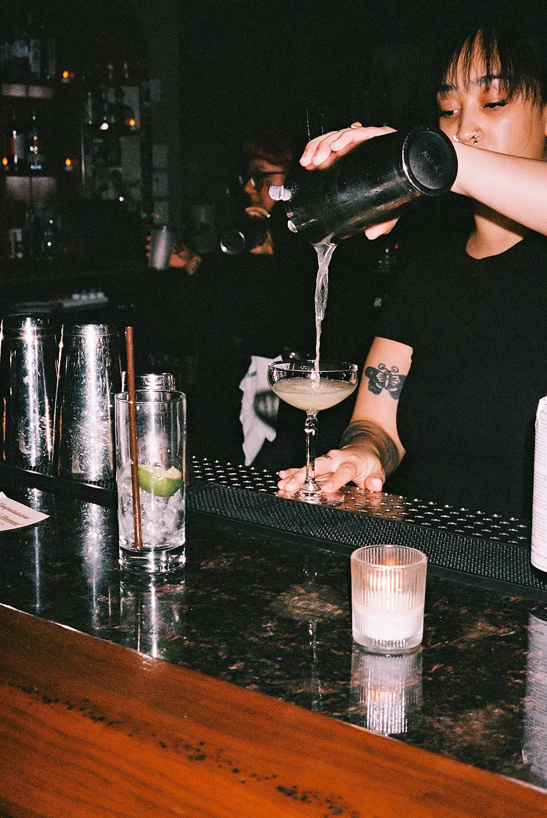 Fun flash photos of lesbian wedding at Dorothy bar. Documentary and candid photos on flash film. Weddings by Grace is a Chicago lesbian queer luxury wedding photographer specializing in portraits, candid, editorial, documentary, + artistic images wit