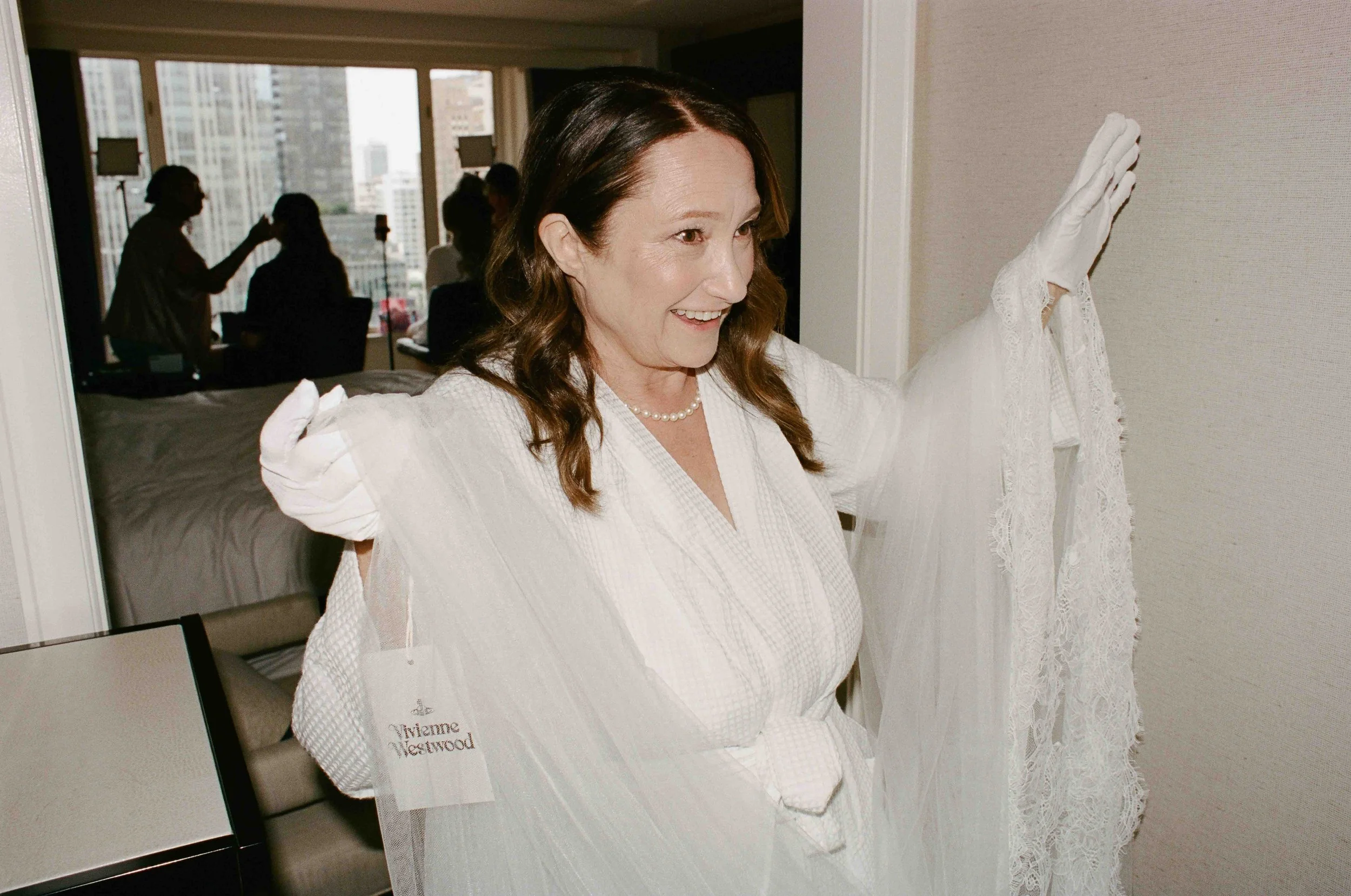 Bride and groom get married at the Chicago History Museum, with creative, lively wedding focused on community, family, laughter. Documentary and candid photos on analog nostalgic film. Weddings by Grace is a Chicago lesbian queer luxury wedding photo