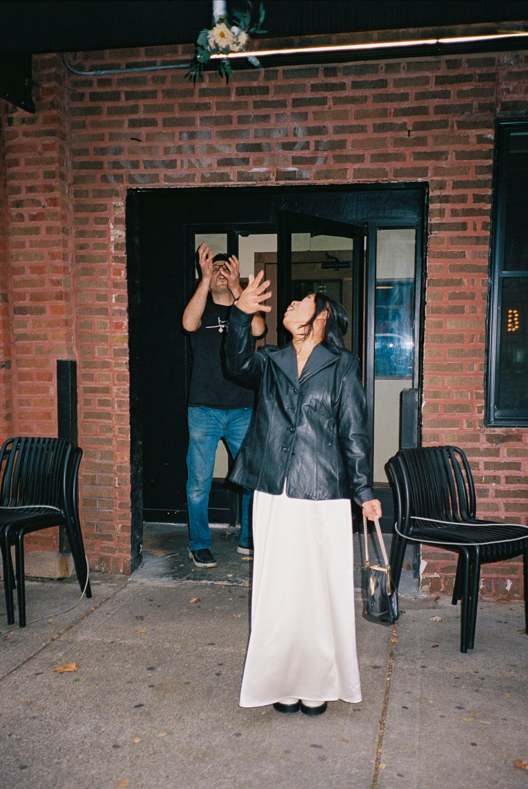 bride and groom toss boquet after City Hall Elopement in downtown chicago on film. Grace Coudal is a Chicago lesbian photographer specializing in portraits, candid, editorial, documentary, events, + weddings. Analog film wedding photography, queer-o