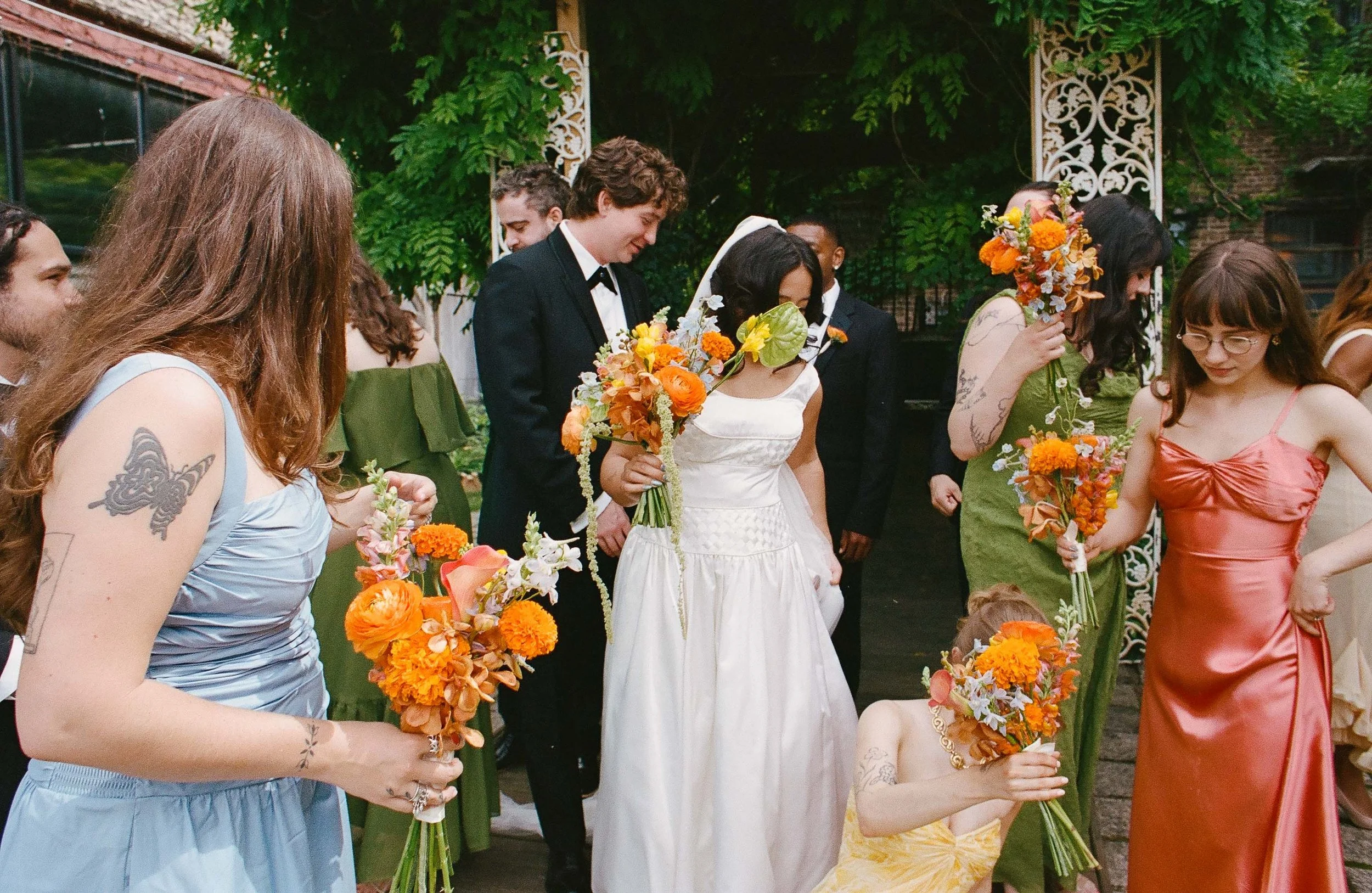 Bride and groom get married in Chicago at Salvage One, with creative, lively wedding focused on community, family, laughter. Documentary and candid photos on analog nostalgic film. Weddings by Grace is a Chicago lesbian queer luxury wedding photograp