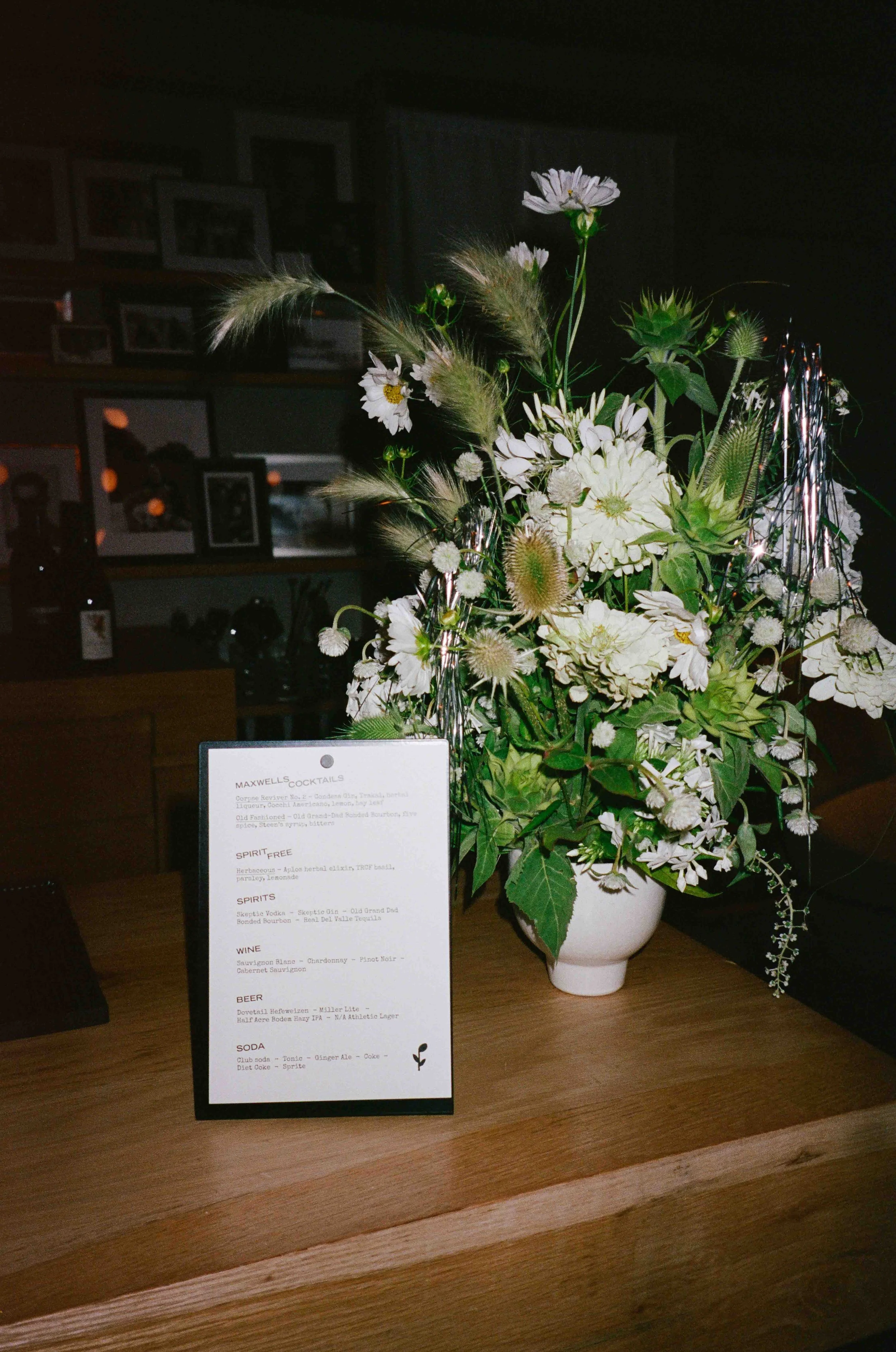 Groom and groom get married at maxwells trading with creative, lively wedding focused on community, queer family, laughter. Documentary and candid photos on analog nostalgic film. Weddings by Grace is a Chicago lesbian queer luxury wedding photograph