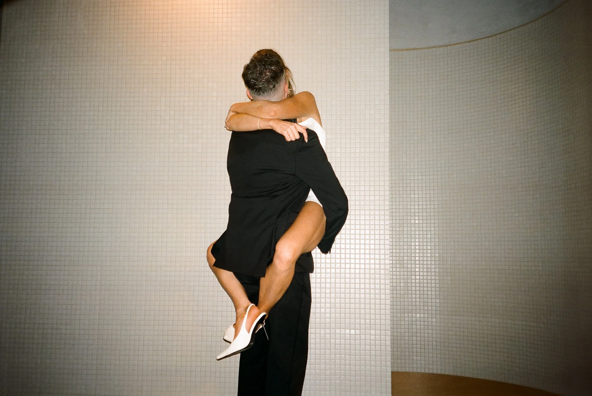 Weddings by grace is a Chicago lesbian queer luxury photographer specializing in portraits, candid, editorial, documentary, + artistic images with analog film photography.