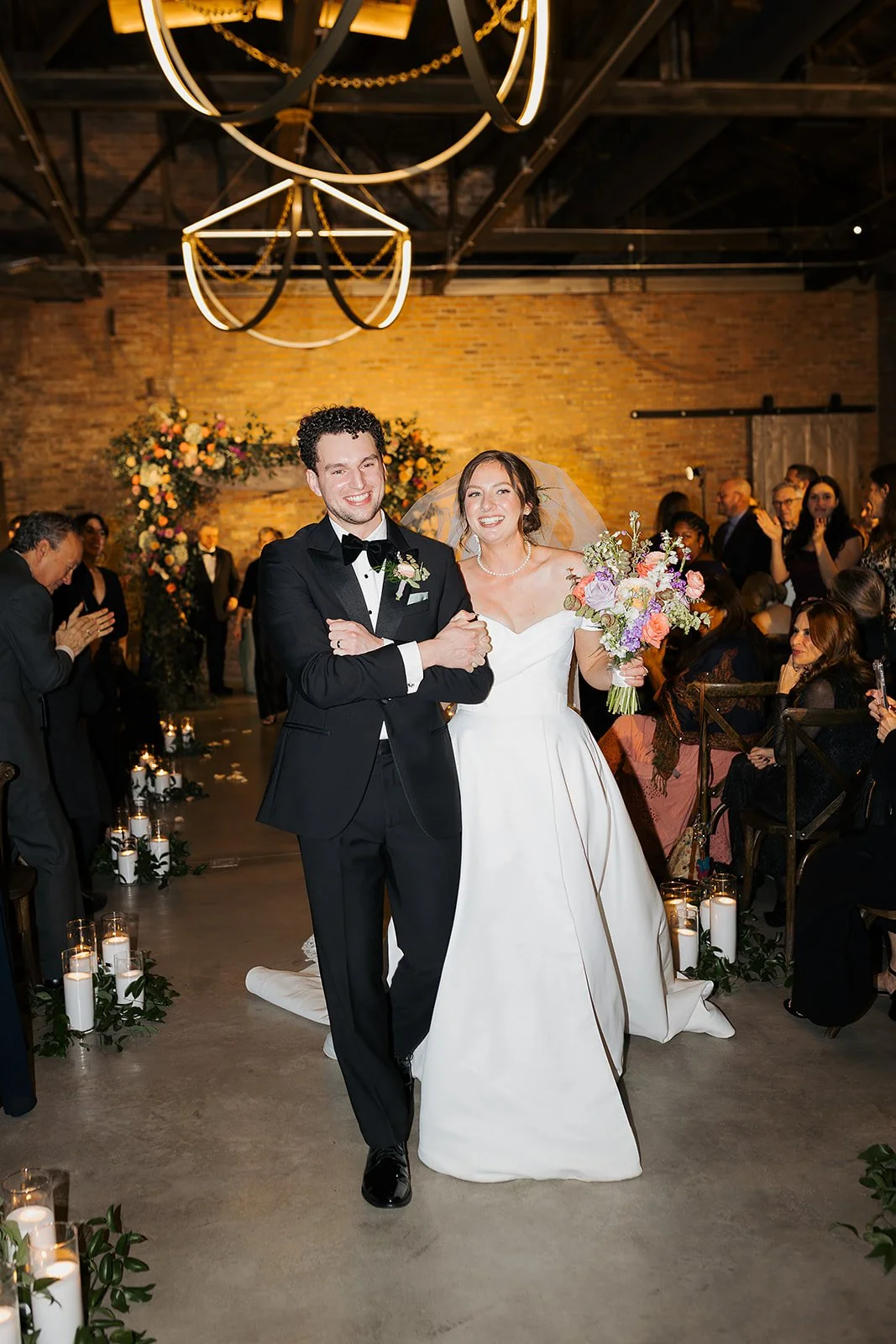 Bride and groom get married in Chicago at WildmanBT, with creative, lively wedding focused on community, family, laughter. Documentary and candid photos on flash film. Weddings by Grace is a Chicago lesbian queer luxury wedding photographer specializ