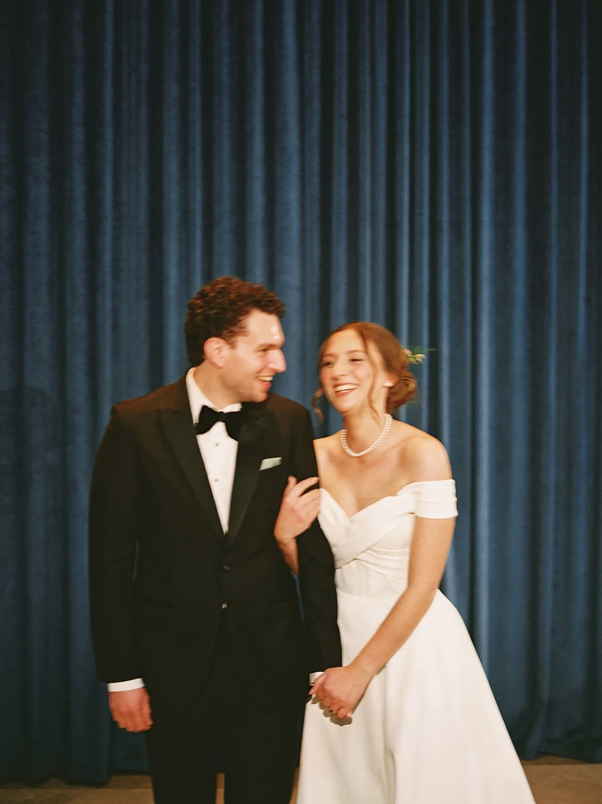 Bride and groom get married in Chicago at WildmanBT, with creative, lively wedding focused on community, family, laughter. Documentary and candid photos on flash film. Weddings by Grace is a Chicago lesbian queer luxury wedding photographer specializ