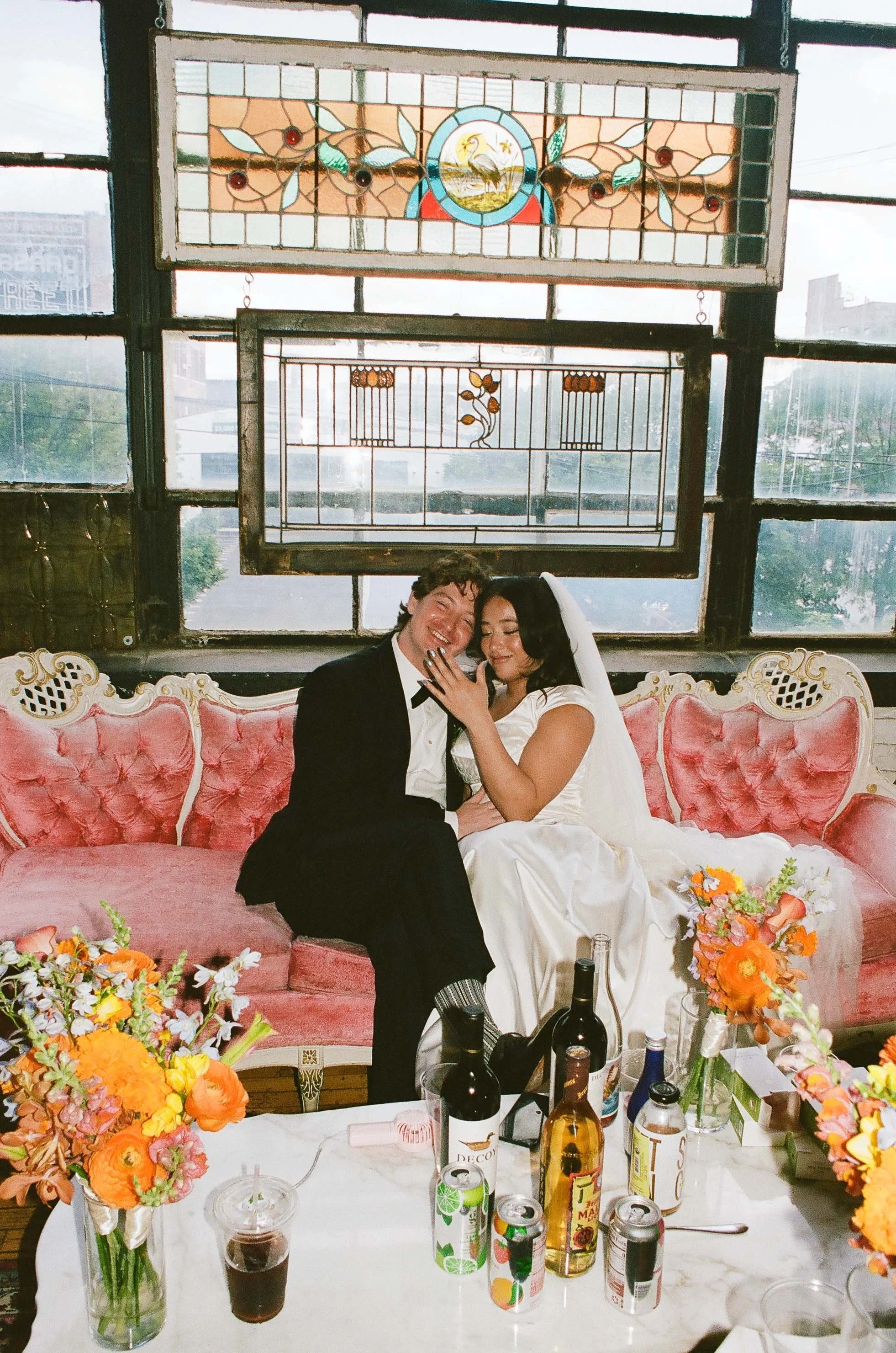 Bride and groom get married in Chicago at Salvage One, with creative, lively wedding focused on community, family, laughter. Documentary and candid photos on analog nostalgic film. Weddings by Grace is a Chicago lesbian queer luxury wedding photograp