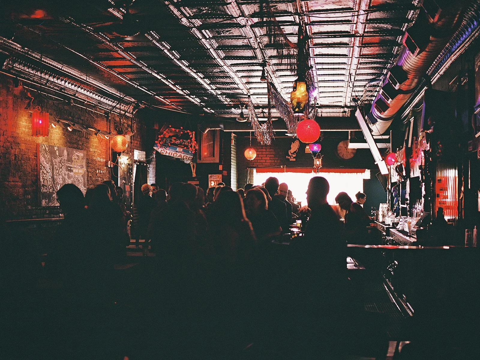 Queer couple gets married in Chicago at the empty bottle with creative, lively wedding focused on community, family, laughter. Documentary and candid photos on analog nostalgic film. Weddings by Grace is a Chicago lesbian queer luxury wedding photogr