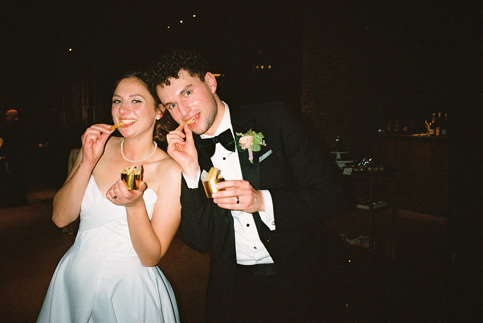 Bride and groom get married in Chicago at WildmanBT, with creative, lively wedding focused on community, family, laughter. Documentary and candid photos on flash film. Weddings by Grace is a Chicago lesbian queer luxury wedding photographer specializ