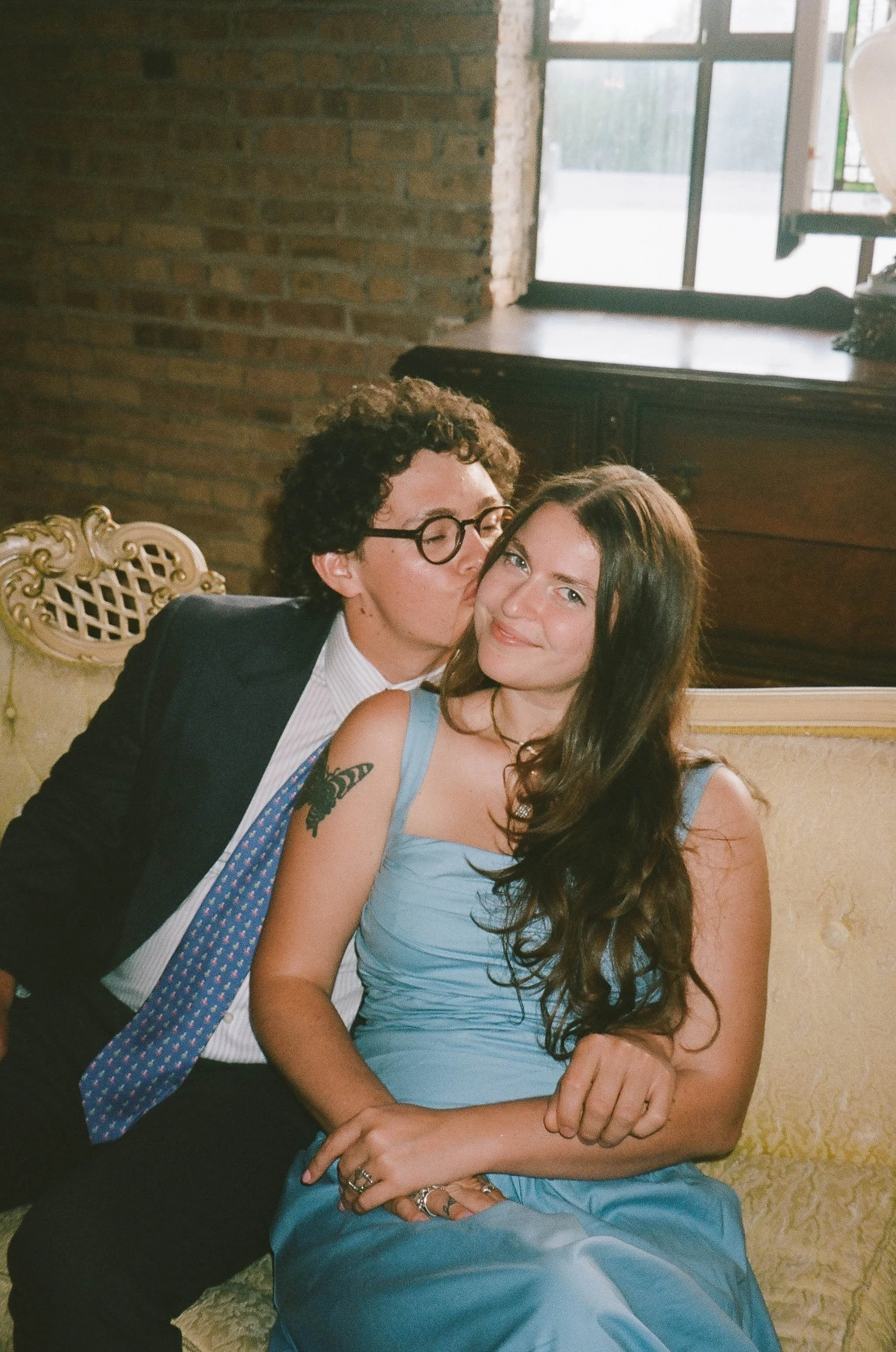 Bride and groom get married in Chicago at Salvage One, with creative, lively wedding focused on community, family, laughter. Documentary and candid photos on analog nostalgic film. Weddings by Grace is a Chicago lesbian queer luxury wedding photograp
