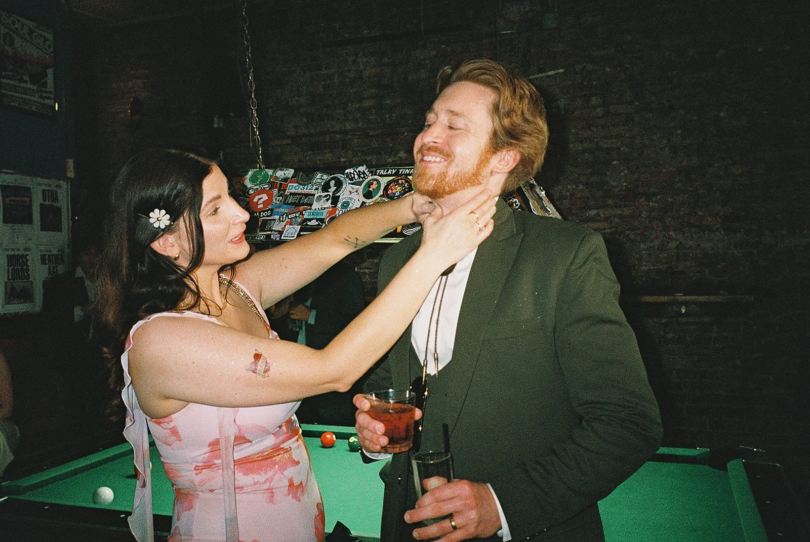 Queer couple gets married in Chicago at the empty bottle with creative, lively wedding focused on community, family, laughter. Documentary and candid photos on analog nostalgic film. Weddings by Grace is a Chicago lesbian queer luxury wedding photogr