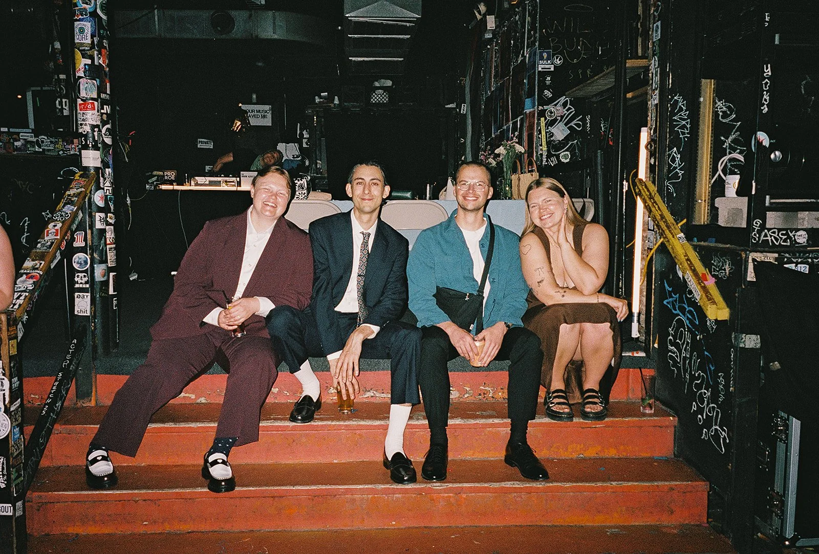 Queer couple gets married in Chicago at the empty bottle with creative, lively wedding focused on community, family, laughter. Documentary and candid photos on analog nostalgic film. Weddings by Grace is a Chicago lesbian queer luxury wedding photogr