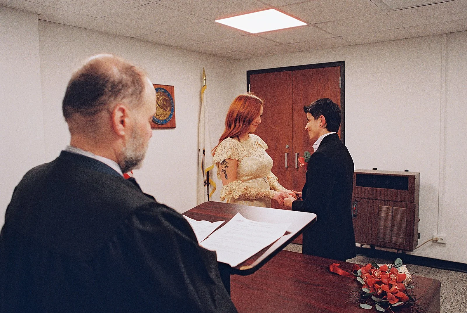 Queer elopement downtown at Chicago’s city hall. Documentary and candid photos on flash film. Weddings by Grace is a Chicago lesbian queer luxury wedding photographer specializing in portraits, candid, editorial, documentary, + artistic images with a