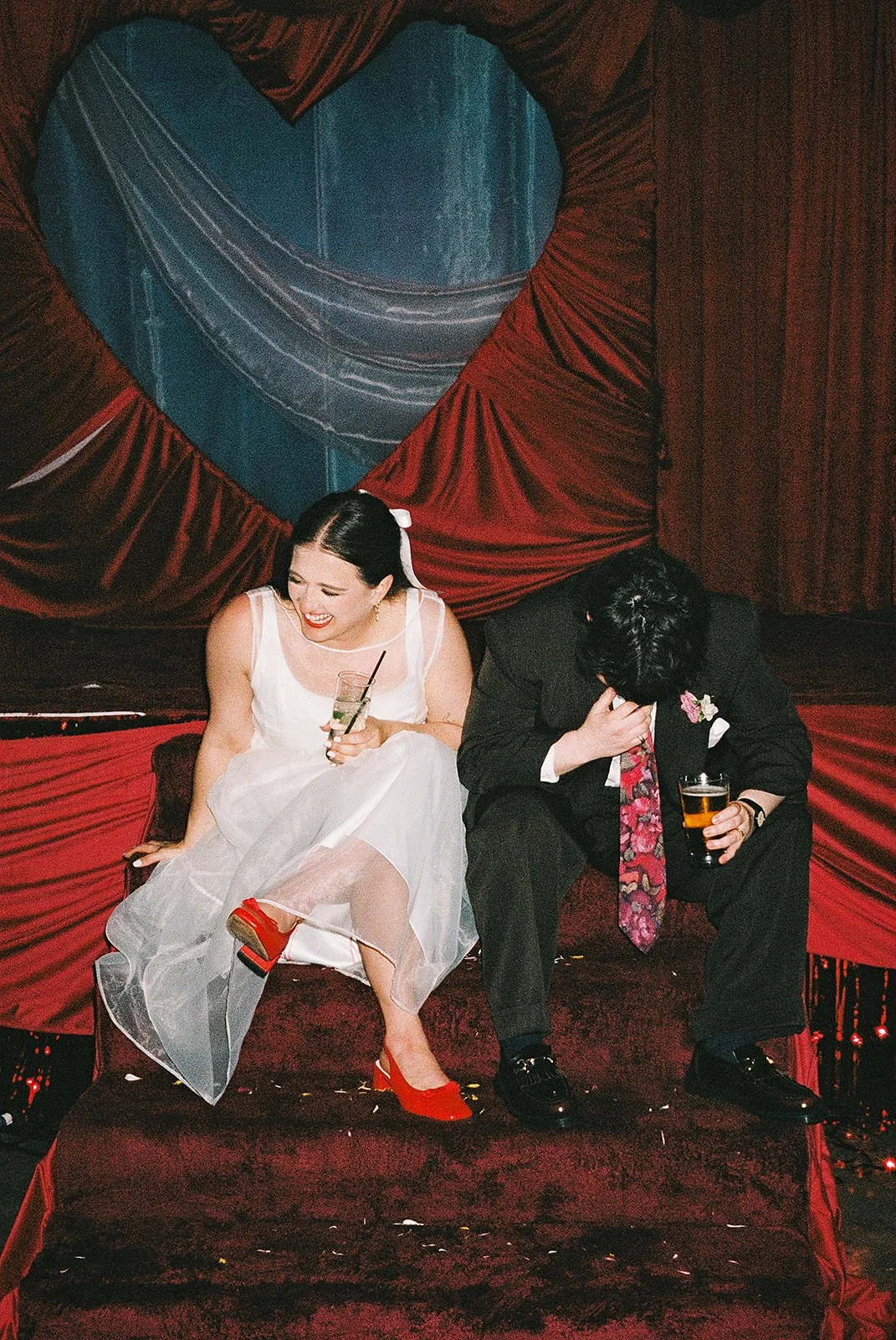 Queer couple gets married in Chicago at the empty bottle with creative, lively wedding focused on community, family, laughter. Documentary and candid photos on analog nostalgic film. Weddings by Grace is a Chicago lesbian queer luxury wedding photogr