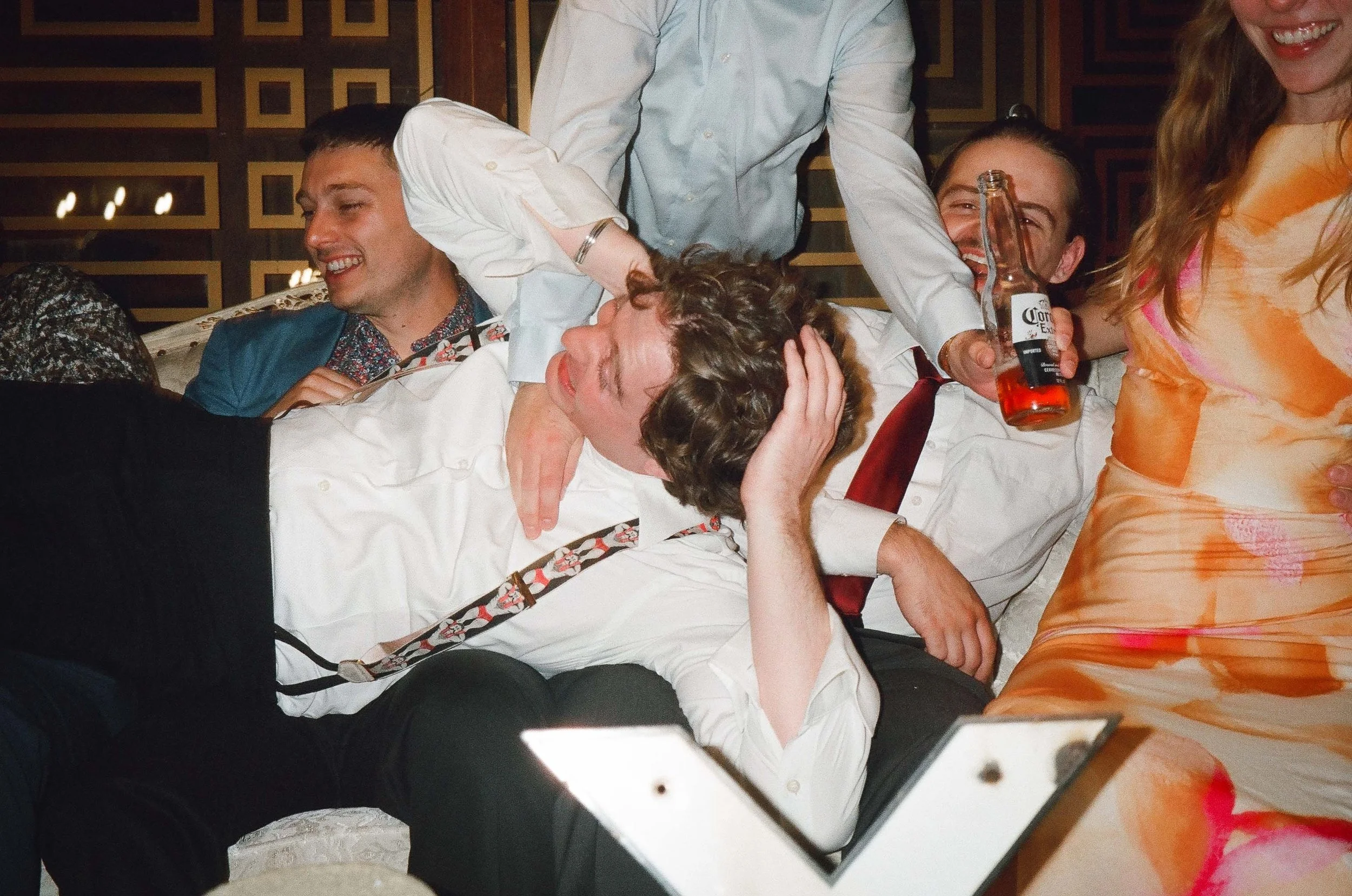 Bride and groom get married in Chicago at Salvage One, with creative, lively wedding focused on community, family, laughter. Documentary and candid photos on analog nostalgic film. Weddings by Grace is a Chicago lesbian queer luxury wedding photograp