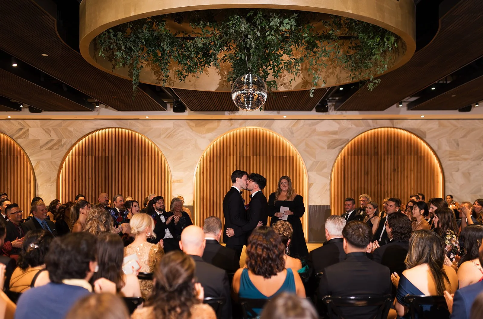 Two grooms get married downtown on Halloween night at chicago winery. Queer, gay, black tie, high-end party and drag show. Documentary and candid photos on flash film. Weddings by Grace is a Chicago lesbian queer luxury wedding photographer specializ