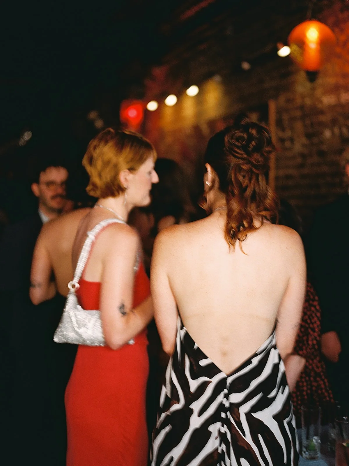 Weddings by grace is a Chicago lesbian queer luxury photographer specializing in portraits, candid, editorial, documentary, + artistic images with analog film photography.