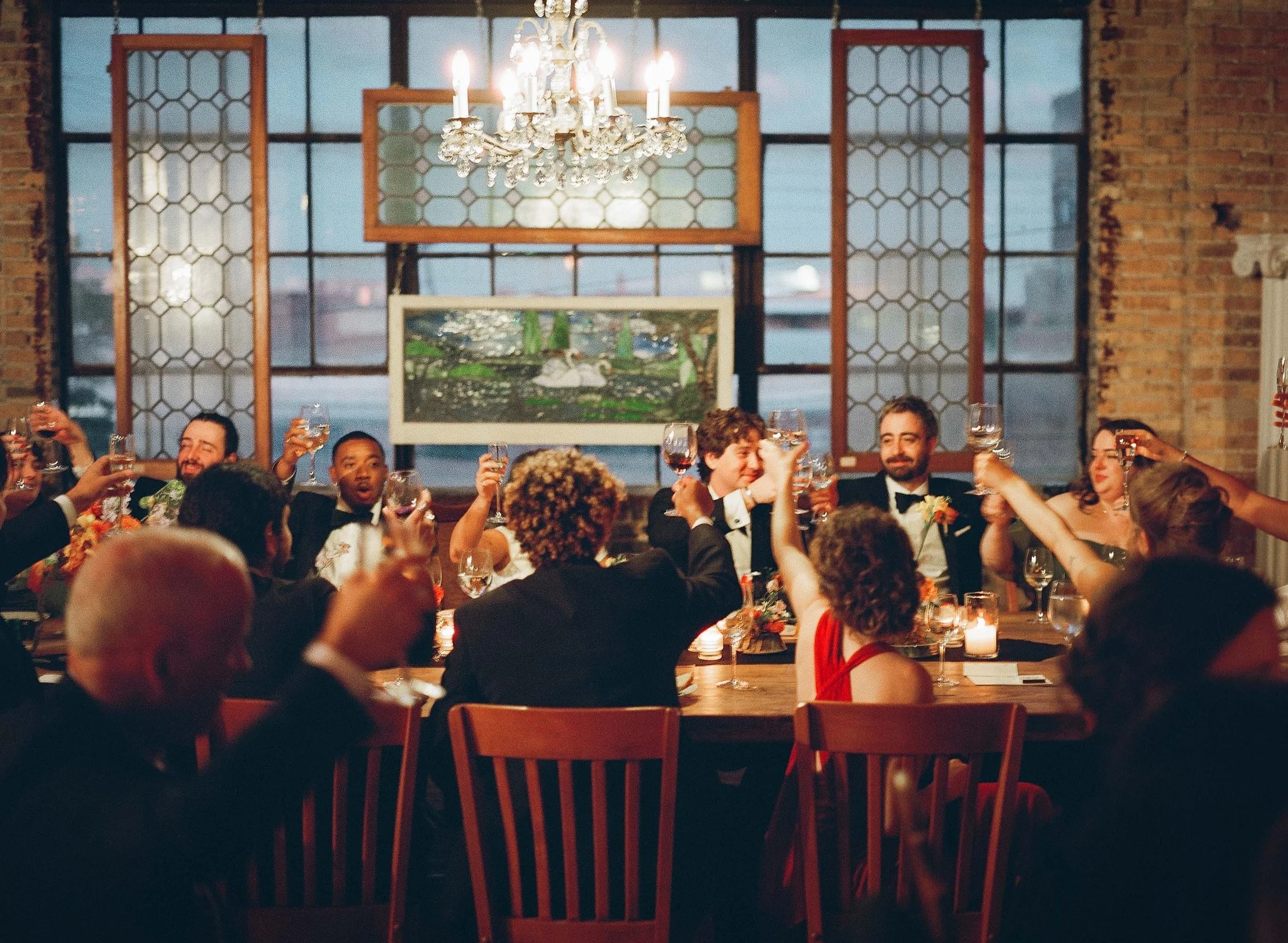 Bride and groom get married in Chicago at Salvage One, with creative, lively wedding focused on community, family, laughter. Documentary and candid photos on analog nostalgic film. Weddings by Grace is a Chicago lesbian queer luxury wedding photograp