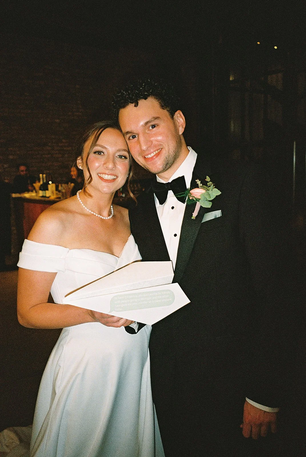 Bride and groom get married in Chicago at WildmanBT, with creative, lively wedding focused on community, family, laughter. Documentary and candid photos on flash film. Weddings by Grace is a Chicago lesbian queer luxury wedding photographer specializ