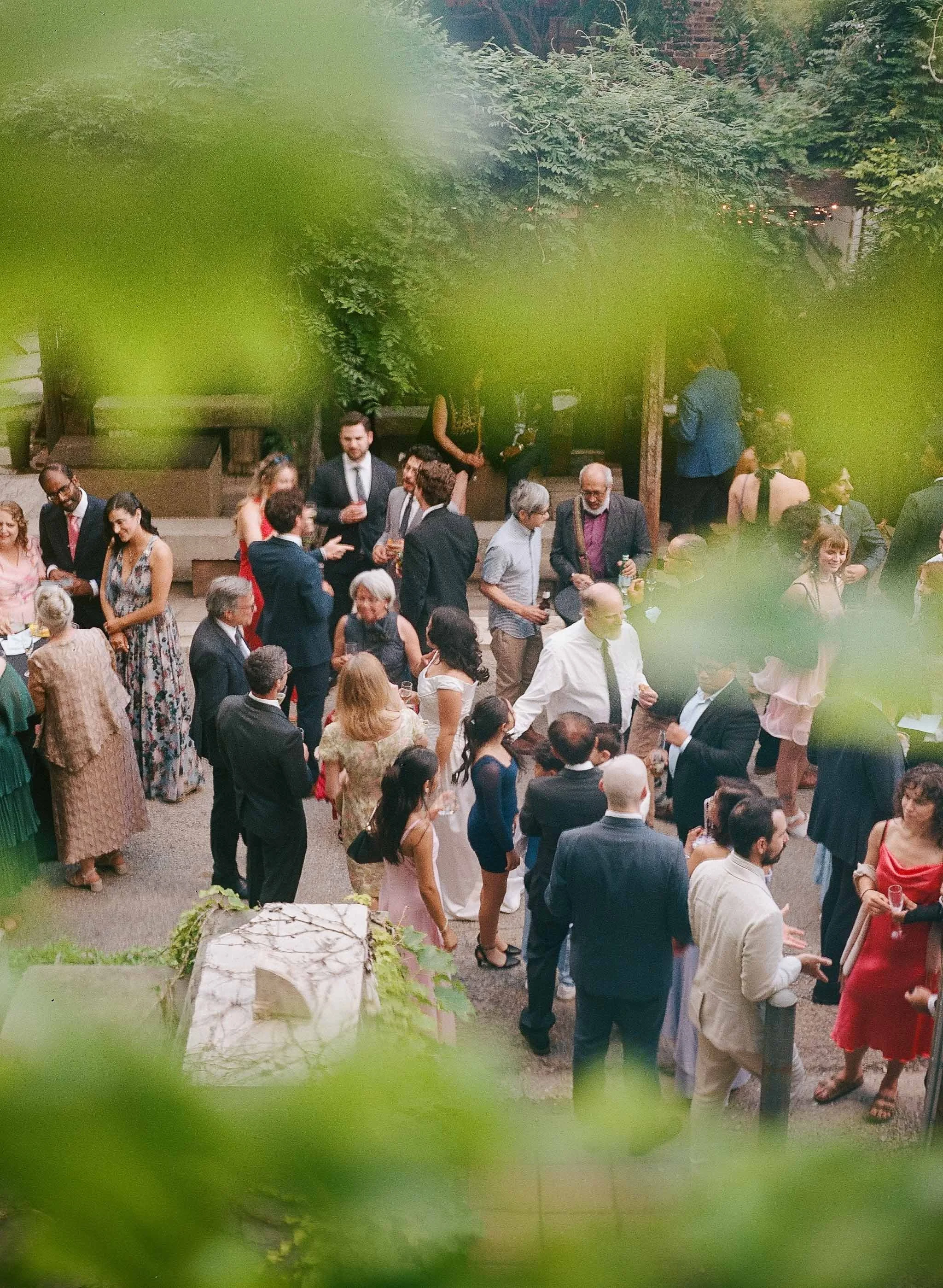 Bride and groom get married in Chicago at Salvage One, with creative, lively wedding focused on community, family, laughter. Documentary and candid photos on analog nostalgic film. Weddings by Grace is a Chicago lesbian queer luxury wedding photograp