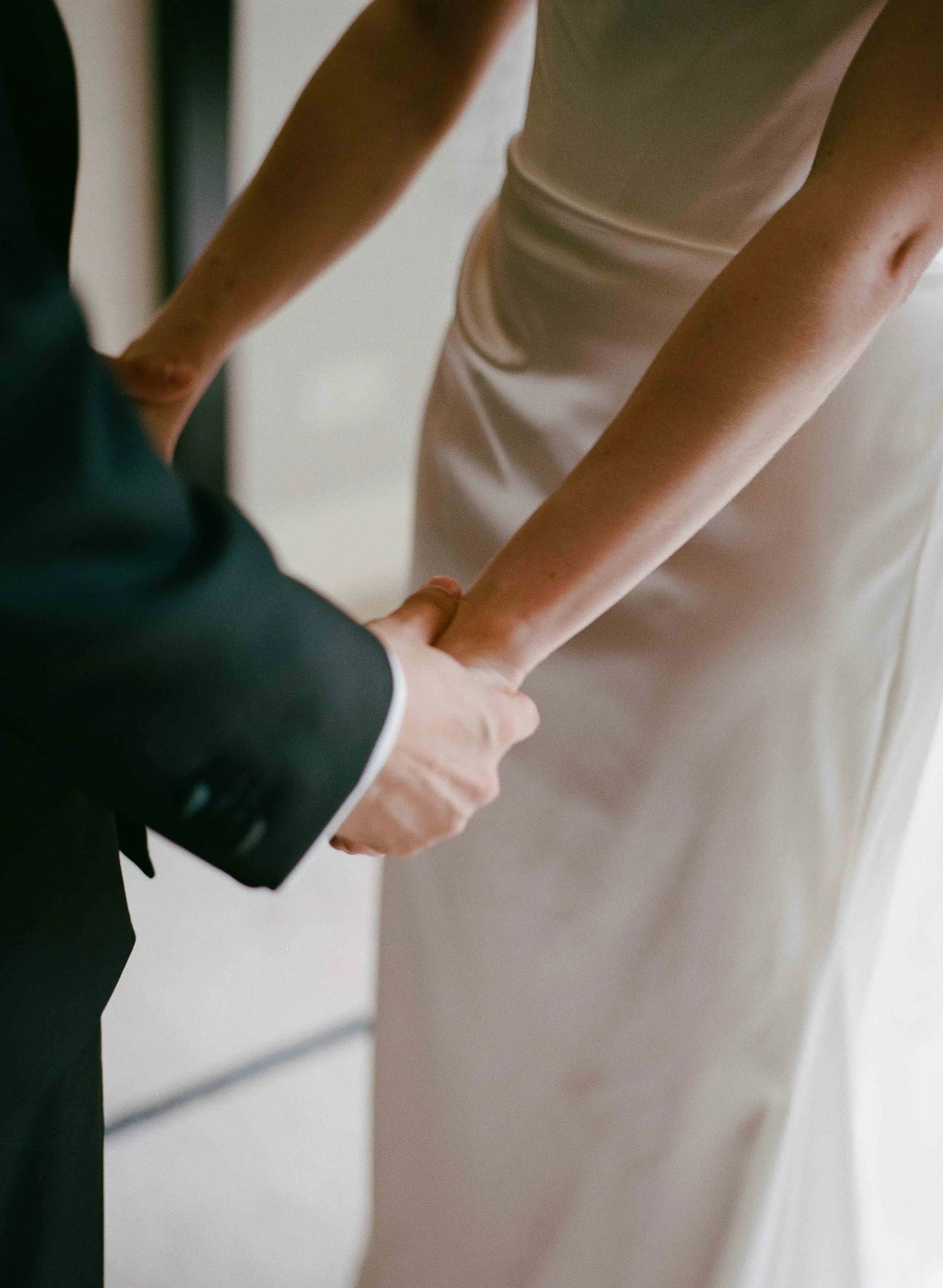 Bride and groom get married at the Chicago History Museum, with creative, lively wedding focused on community, family, laughter. Documentary and candid photos on analog nostalgic film. Weddings by Grace is a Chicago lesbian queer luxury wedding photo