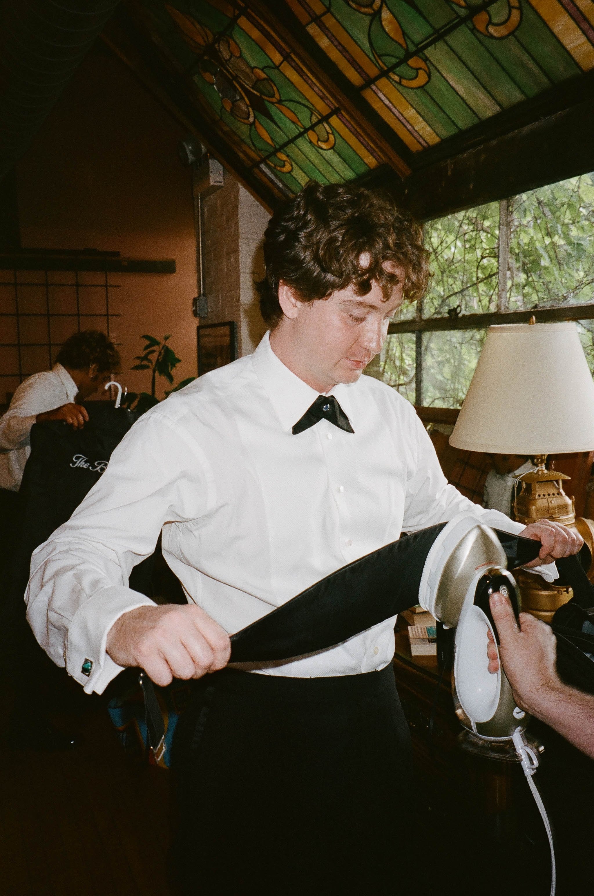 Bride and groom get married in Chicago at Salvage One, with creative, lively wedding focused on community, family, laughter. Documentary and candid photos on analog nostalgic film. Weddings by Grace is a Chicago lesbian queer luxury wedding photograp