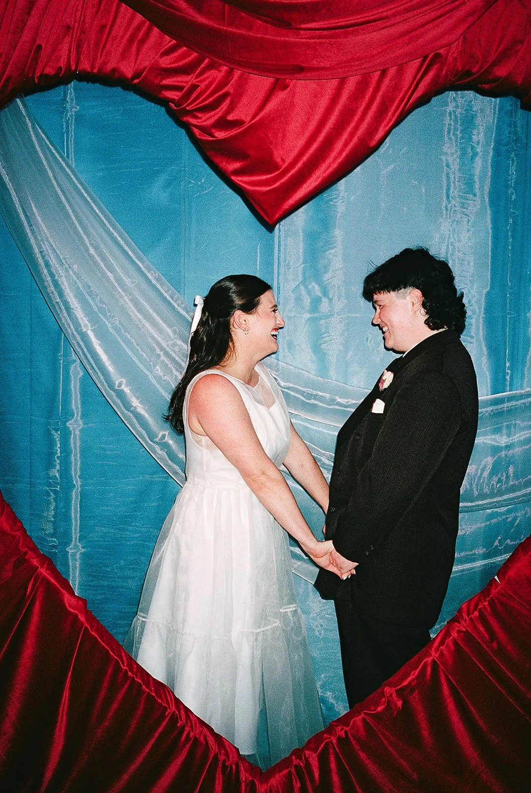 Queer couple gets married in Chicago at the empty bottle with creative, lively wedding focused on community, family, laughter. Documentary and candid photos on analog nostalgic film. Weddings by Grace is a Chicago lesbian queer luxury wedding photogr
