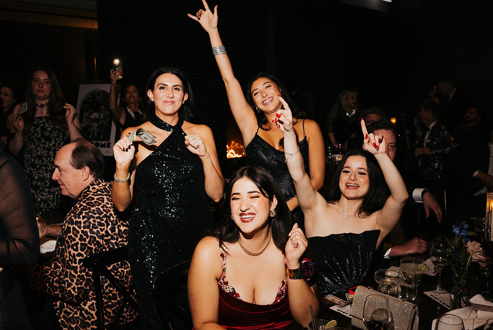 Two grooms get married downtown on Halloween night at chicago winery. Queer, gay, black tie, high-end party and drag show. Documentary and candid photos on flash film. Weddings by Grace is a Chicago lesbian queer luxury wedding photographer specializ