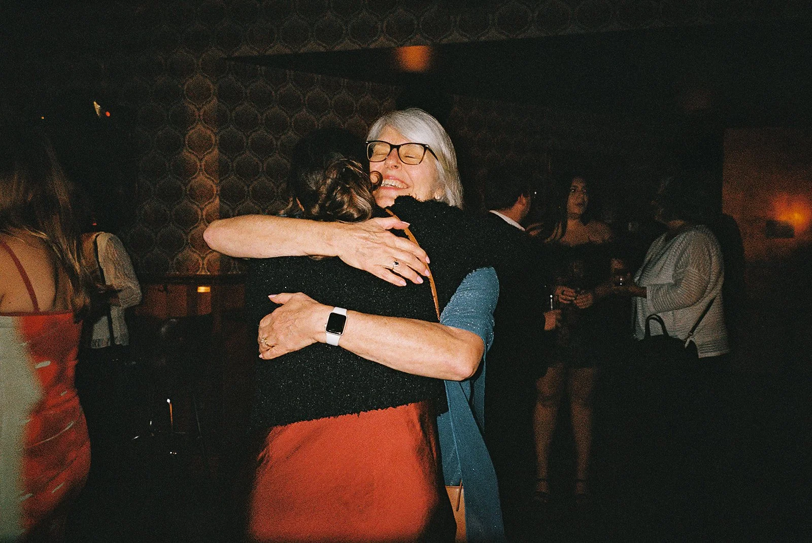 Fun flash photos of lesbian wedding at Dorothy bar. Documentary and candid photos on flash film. Weddings by Grace is a Chicago lesbian queer luxury wedding photographer specializing in portraits, candid, editorial, documentary, + artistic images wit