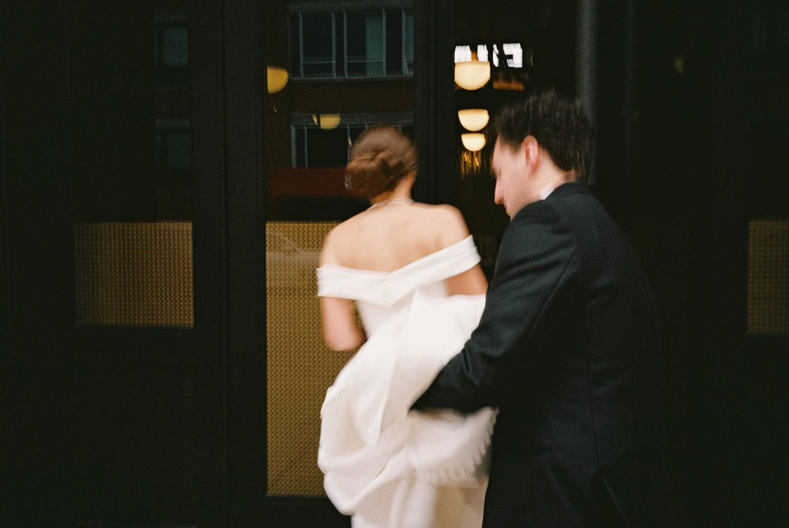 Bride and groom get married in Chicago at WildmanBT, with creative, lively wedding focused on community, family, laughter. Documentary and candid photos on flash film. Weddings by Grace is a Chicago lesbian queer luxury wedding photographer specializ